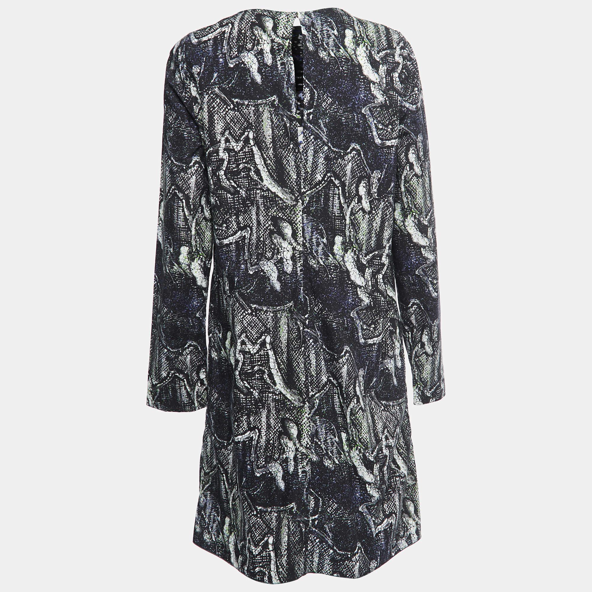 This designer dress is a chic and stylish garment that exudes elegance and sophistication. With its sleek design flattering silhouette and high quality craftsmanship this dress is perfect for any special occasion or evening event ensuring you stand