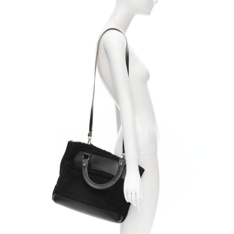 MARNI borsa morbida con manico superiore foderata in shearling nero
Riferimento: CELG/A00050
Marchio: Marni
Modello: Tote in shearling
Materiale: Pelle
Colore: nero
Modello: Tinta unita
Fodera:  Shearling
Dettagli extra: Tracolla