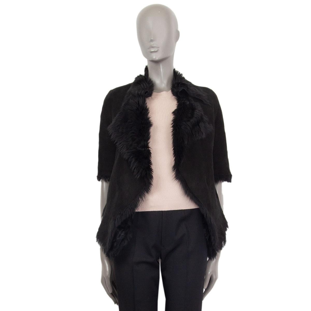 authentic Marni short sleeve shearling jacket in black lamb leather (100%). Closes with two concealed hooks on the front and has slit pockets. Has been worn and is in excellent condition.

Tag Size 38
Size XS
Shoulder Width 38cm (14.8in)
Bust 94cm