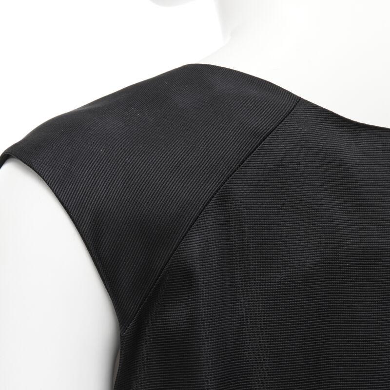 MARNI black V-neck heavy acetate panelled back hem sleeveless boxy top IT38 XS
Reference: CELG/A00119
Brand: Marni
Model: Black vest
Material: Acetate
Color: Black
Pattern: Solid
Extra Details: Dual side slit pockets.
Made in: