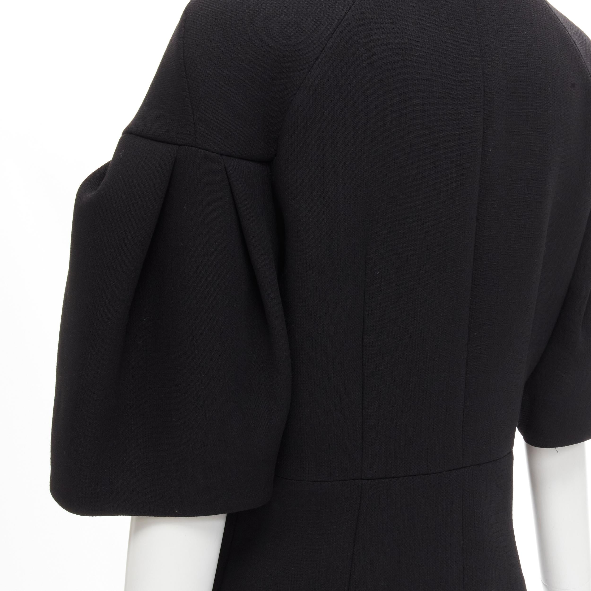 MARNI black virgin wool crepe short bell sleeve curved waist jacket IT40 S 
Reference: AEMA/A00041 
Brand: Marni 
Material: Wool 
Color: Black 
Pattern: Solid 
Closure: Zip 
Extra Detail: Concealed zip with snap button closure. Rounded spread