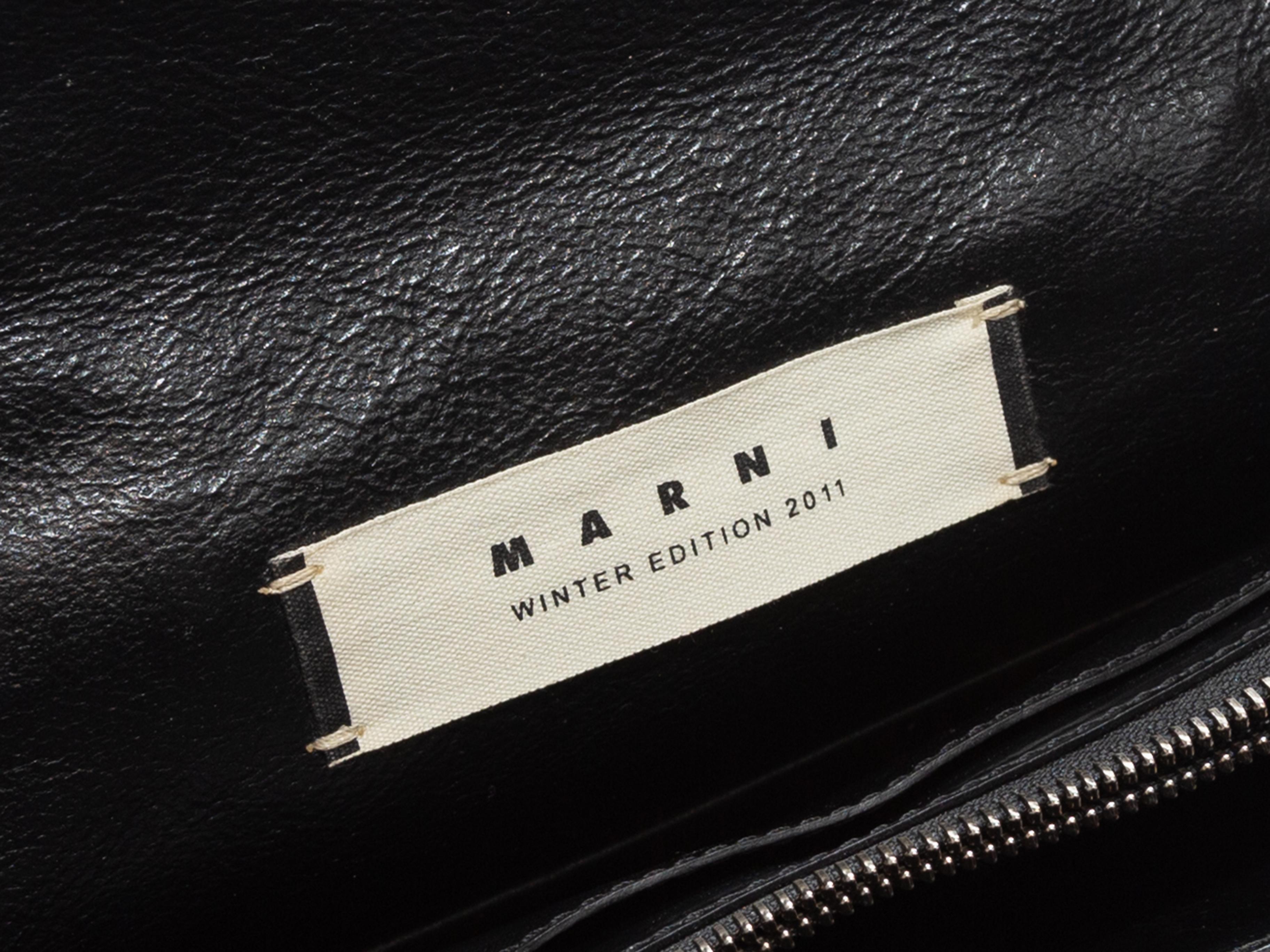 Product details: Black leather handbag by Marni. From the Winter 2011 Collection. Interior zip pocket. Rolled top handle. Dual turn-lock closures at front flap. 10