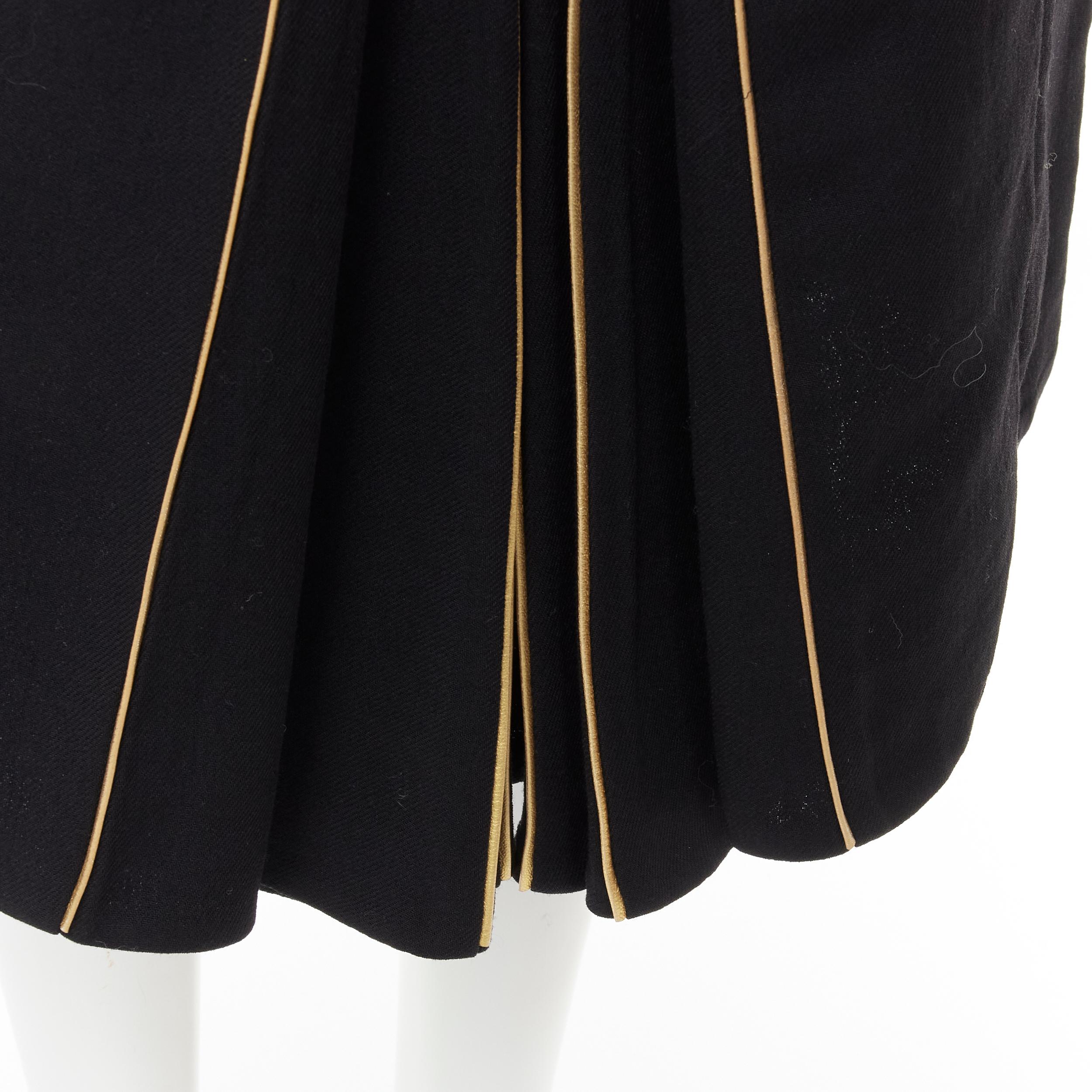 MARNI black wool gold piping flared vent knee skirt IT40 S 
Reference: CELG/A00097 
Brand: Marni 
Material: Wool 
Color: Black 
Pattern: Solid 
Closure: Zip 
Extra Detail: Genuine leather piping 
Made in: Italy 

CONDITION: 
Condition: Excellent,