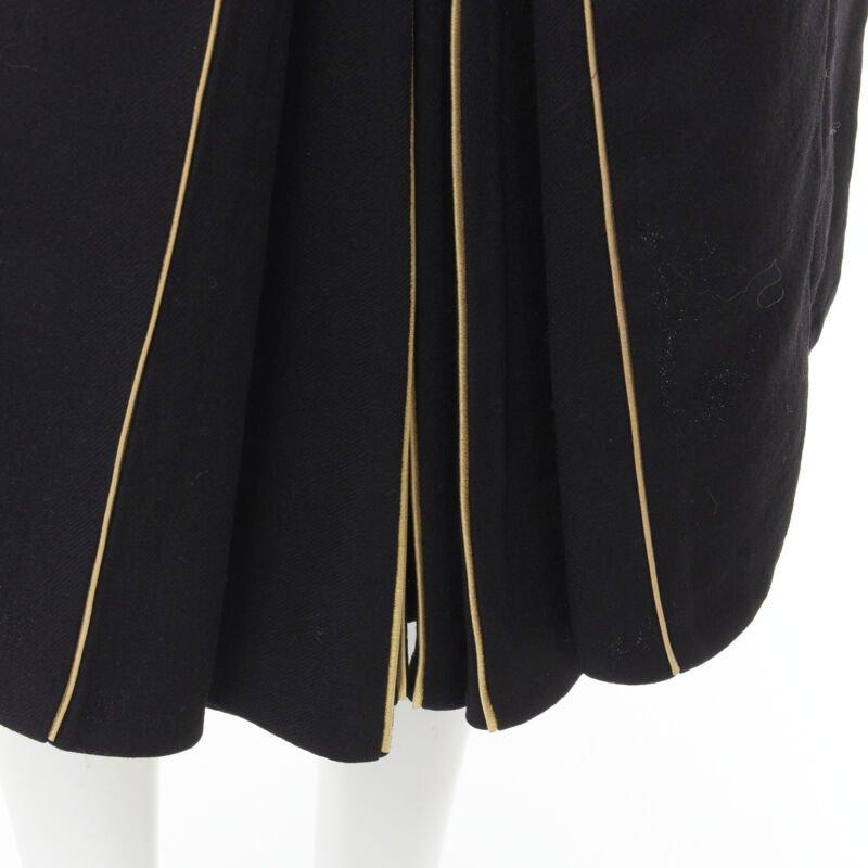 MARNI black wool gold piping flared vent knee skirt IT40 S
Reference: CELG/A00097
Brand: Marni
Material: Wool, Blend
Color: Black, Gold
Pattern: Solid
Closure: Zip
Extra Details: Genuine leather piping
Made in: Italy

CONDITION:
Condition: