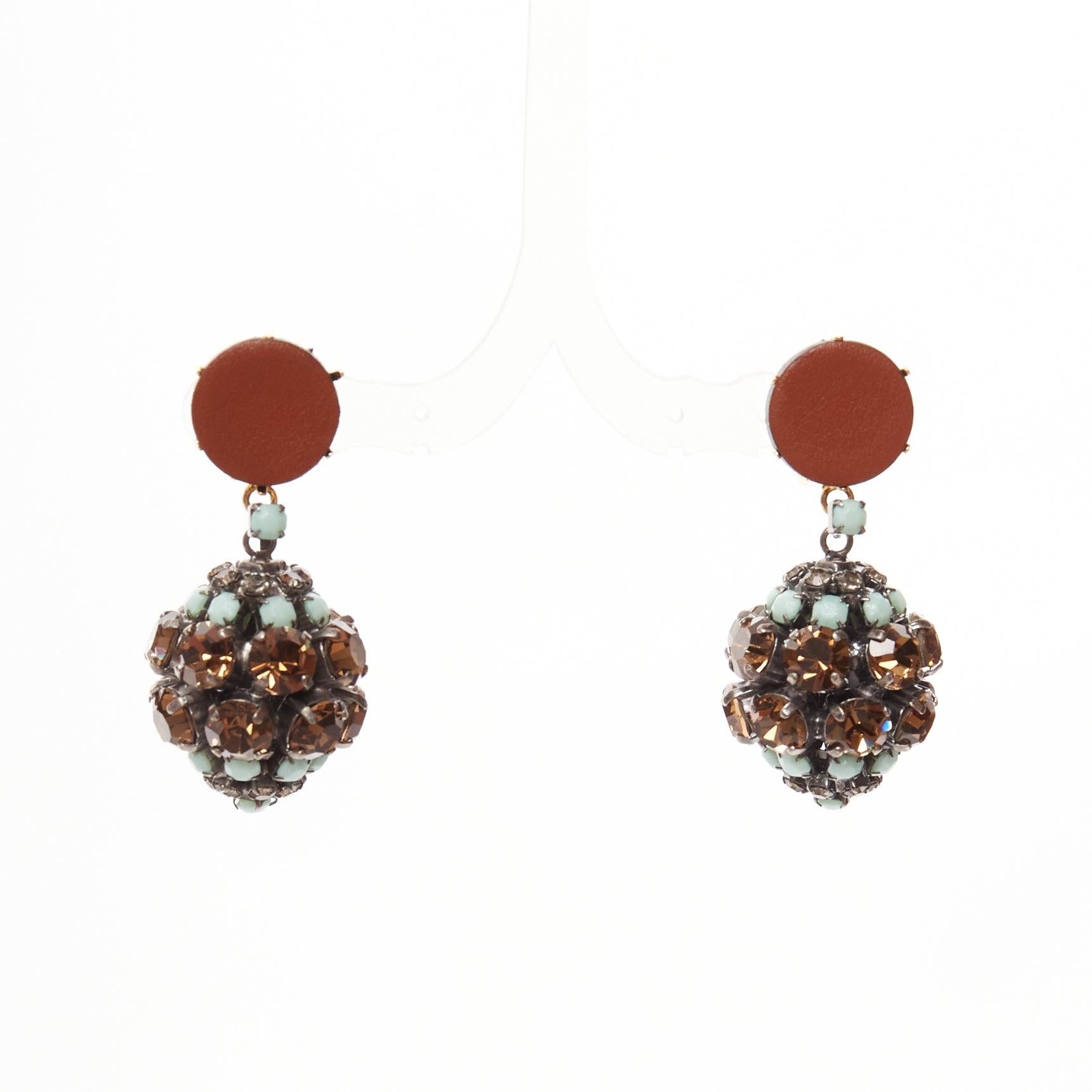 MARNI blue crystal drop ball brown leather dangling clip on earrings
Reference: AAWC/A01228
Brand: Marni
Material: Metal, Leather
Color: Brown, Blue
Pattern: Crystals
Closure: Clip On
Lining: Gold Metal
Made in: Italy

CONDITION:
Condition: