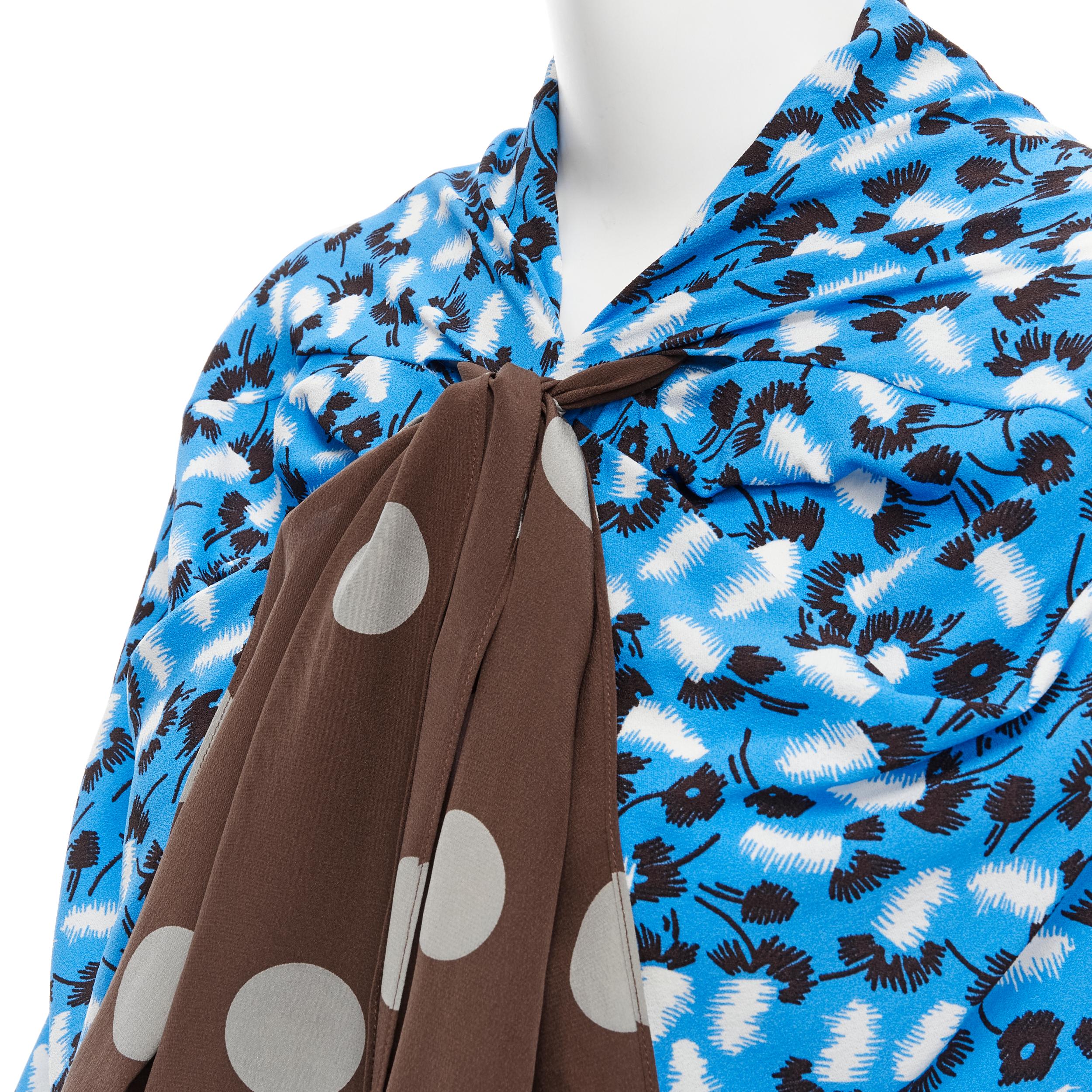 MARNI blue scribble print crepe brown polka dot bow scarf draped top IT40 S 
Reference: CELG/A00084 
Brand: Marni 
Material: Polyester 
Color: Blue 
Pattern: Abstract 
Closure: Zip 
Extra Detail: Brown polka dot scarf. Gathered drape detailing at