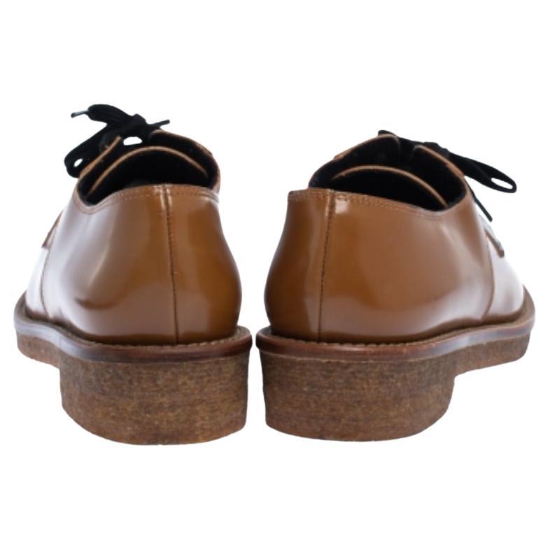  These stylish Marni Derbes are perfect for a host of occasions. Crafted in Italy, they are made from glossy leather and come in lovely hues of brown & black. They have been designed with lace-ups, low platforms and durable rubber soles.