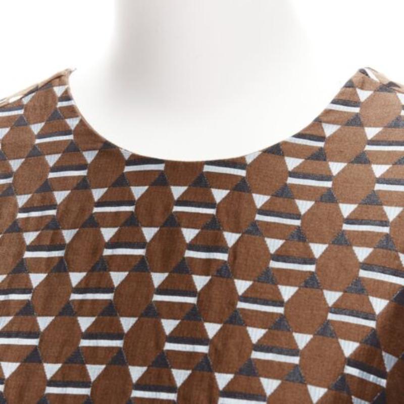 MARNI brown blue geometric jacquard frill hem dress IT38 XS
Reference: CELG/A00299
Brand: Marni
Material: Cotton, Blend
Color: Brown, Blue
Pattern: Geometric
Closure: Slip On
Made in: Italy

CONDITION:
Condition: Very good, this item was pre-owned