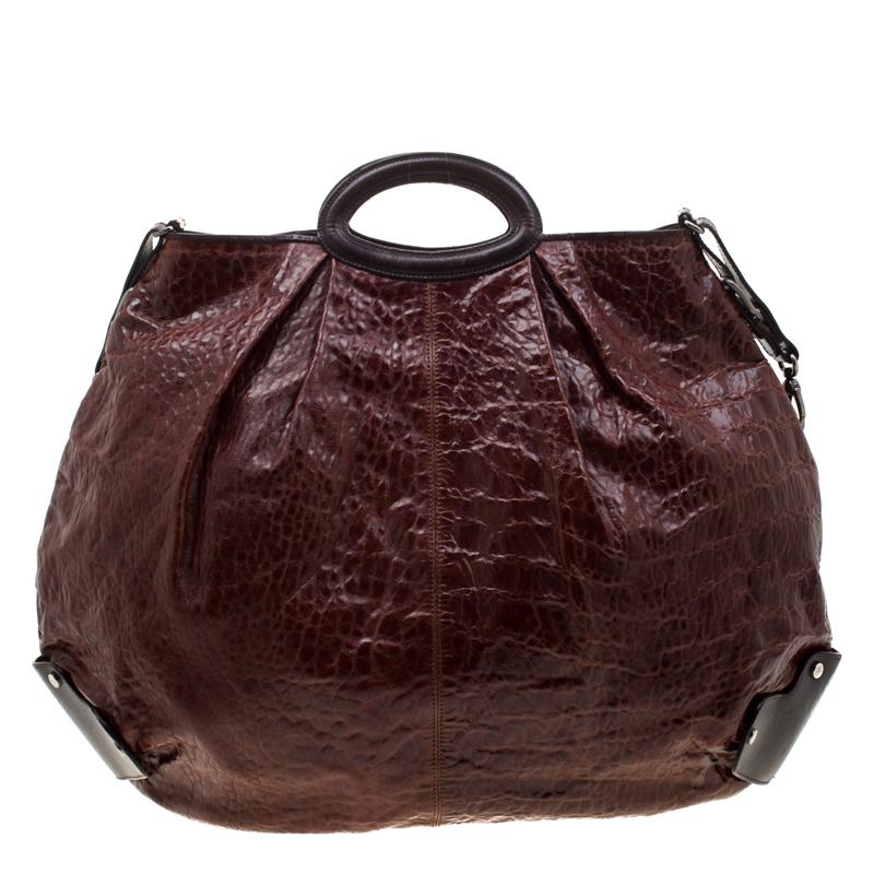 This Marni bag makes a stunning addition to any modern day edit. Crafted from croc-embossed leather, this hobo features dual handles and a shoulder strap. It has a spacious nylon lined interior that will hold much more than your