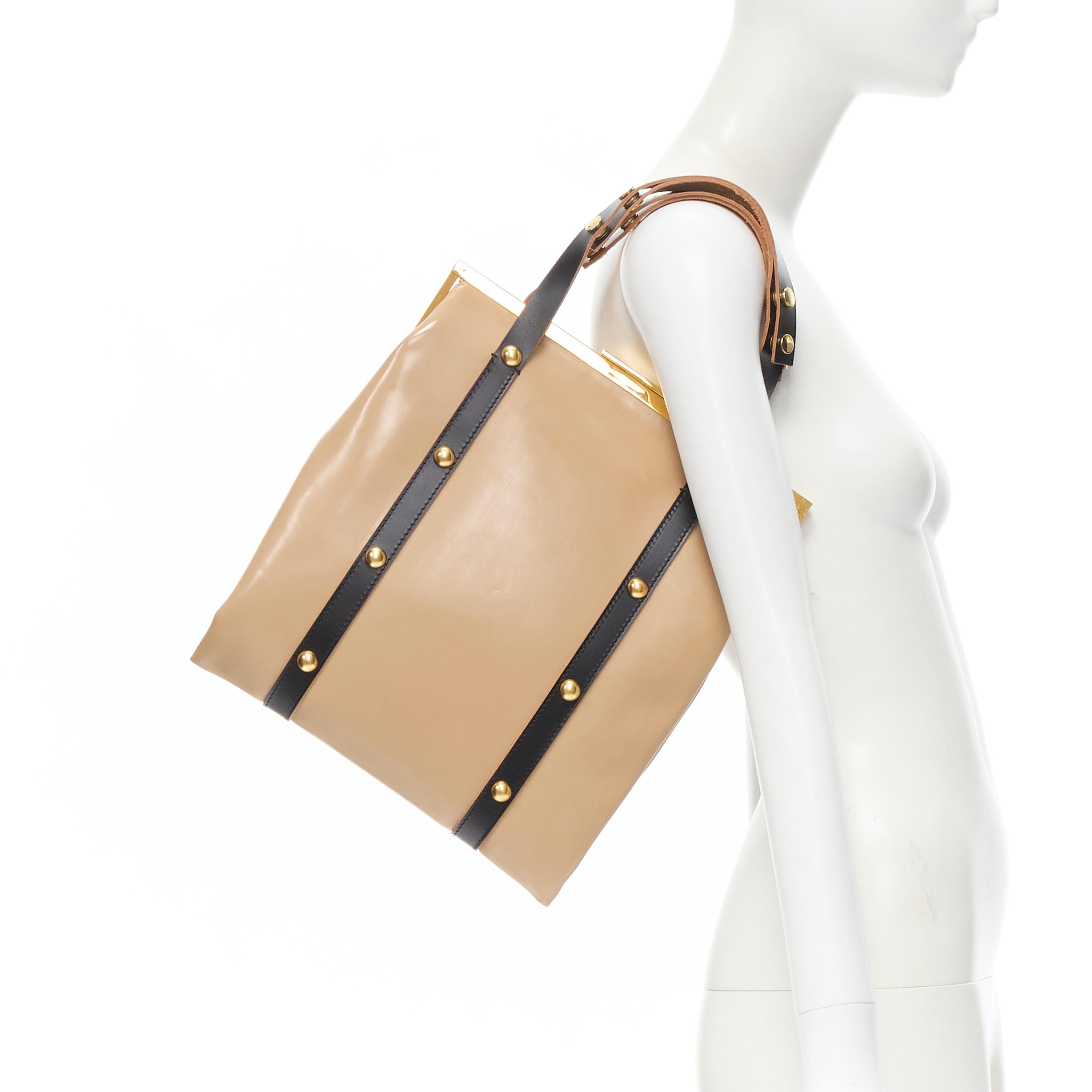 MARNI brown latex PVC gold stud leather trim metal frame tote bag 
Reference: CELG/A00039 
Brand: Marni 
Model: Latex tote 
Material: Latex, leather 
Color: Brown 
Pattern: Solid 
Closure: Clasp 
Extra Detail: Clasp lock. 

CONDITION: 
Condition: