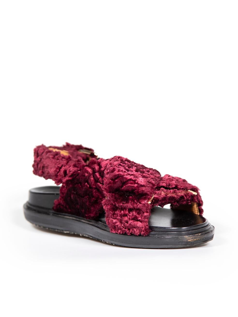 CONDITION is Very good. Minimal wear to sandals is evident. Minimal wear to both shoe straps with missing patches of fur on this used Marni designer resale item.
 
 Details
 Fussbett
 Burgundy
 Faux shearling
 Slides
 Buckle ankle strap
 Open toe
 
