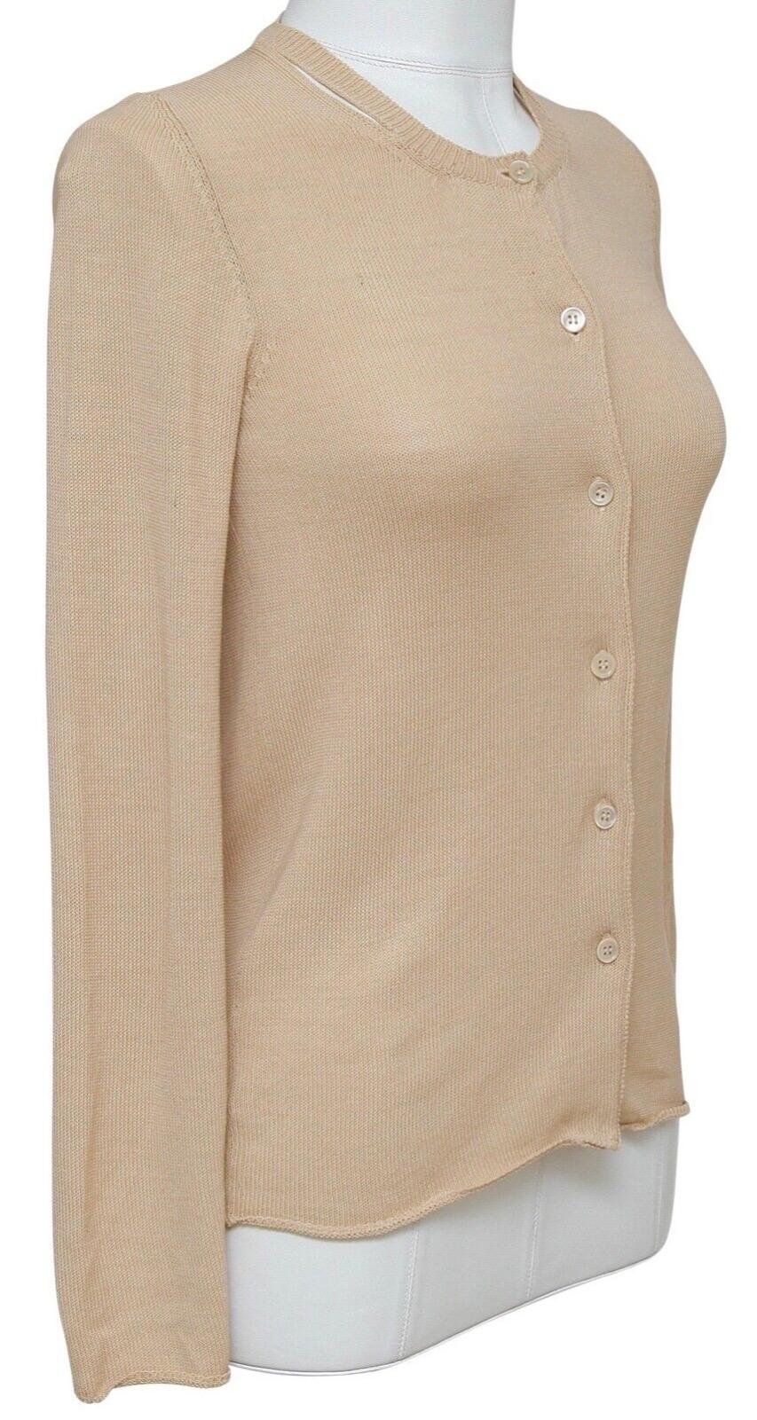 GUARANTEED AUTHENTIC LOVELY MARNI BEIGE LONG SLEEVE CARDIGAN

Details:
- Lightweight beige color cardigan has a great easy fit.
- Long sleeve.
- Crewneck with cutout detail.
- Front button closure.
- Easy and year round great piece for your Marni