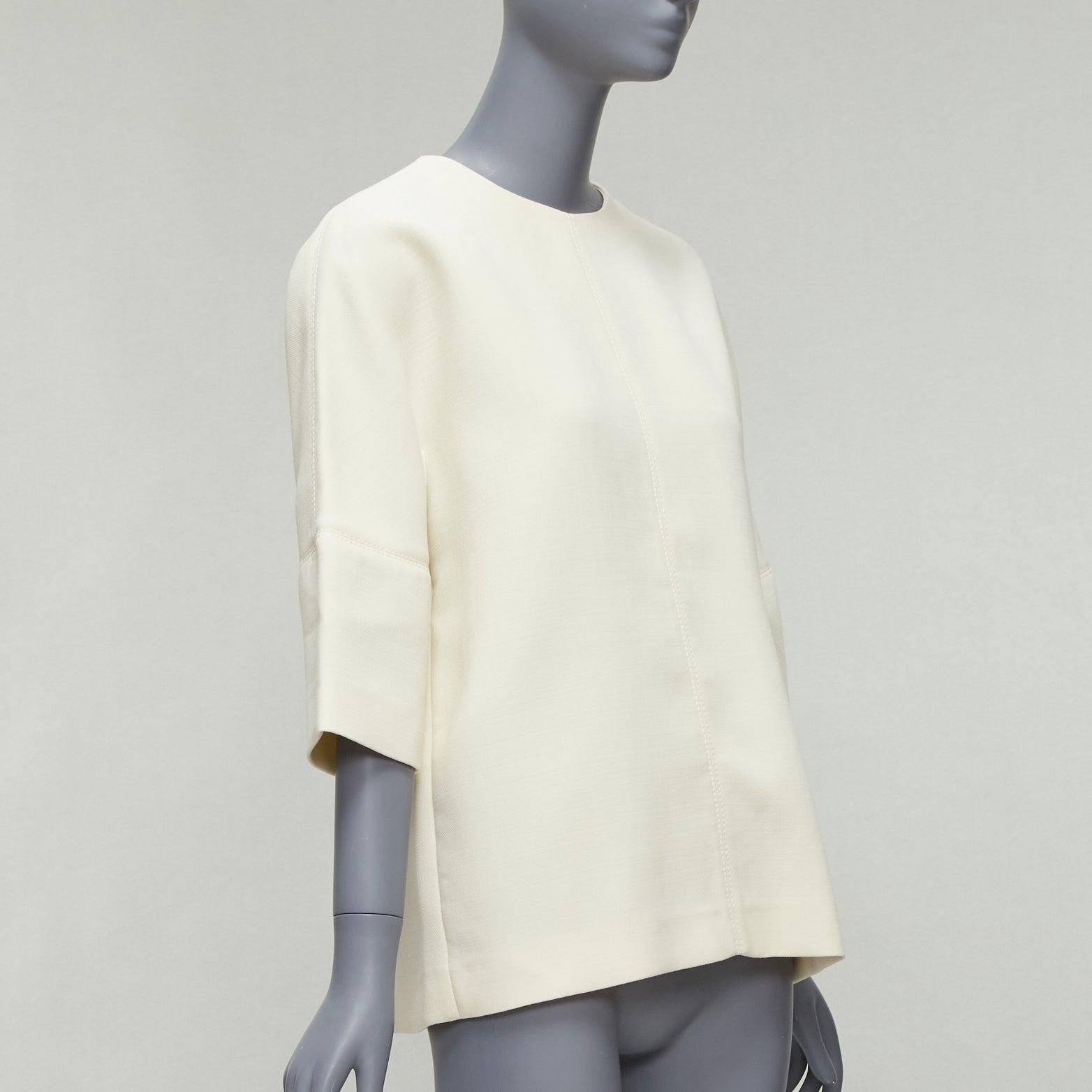 MARNI cream 100% virgin wool dolman panelled sleeves cocoon boxy top IT38 XS
Reference: CELG/A00311
Brand: Marni
Material: Virgin Wool
Color: Cream
Pattern: Solid
Closure: Zip
Extra Details: Back zip.
Made in: Italy

CONDITION:
Condition: Very good,