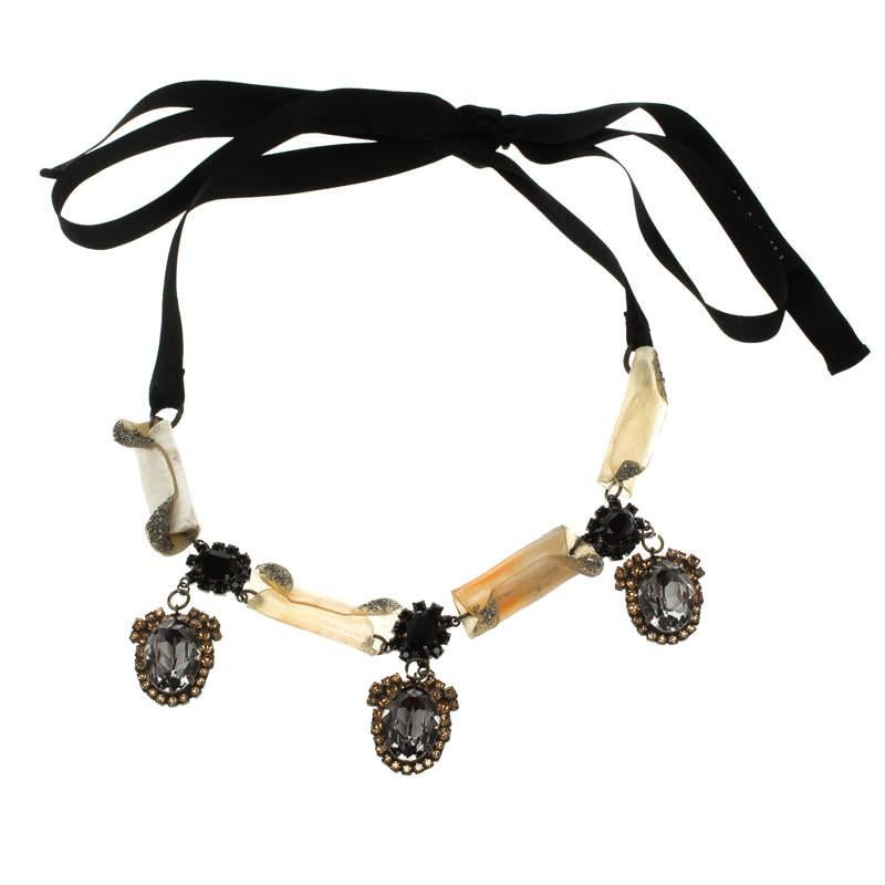 Accessories that are high on style are absolutely worth the buy, such as this necklace by Marni. It has been so well assembled with crystals and resin while being held by a ribbon that has a self-tie closure. The embellishments are breathtaking and