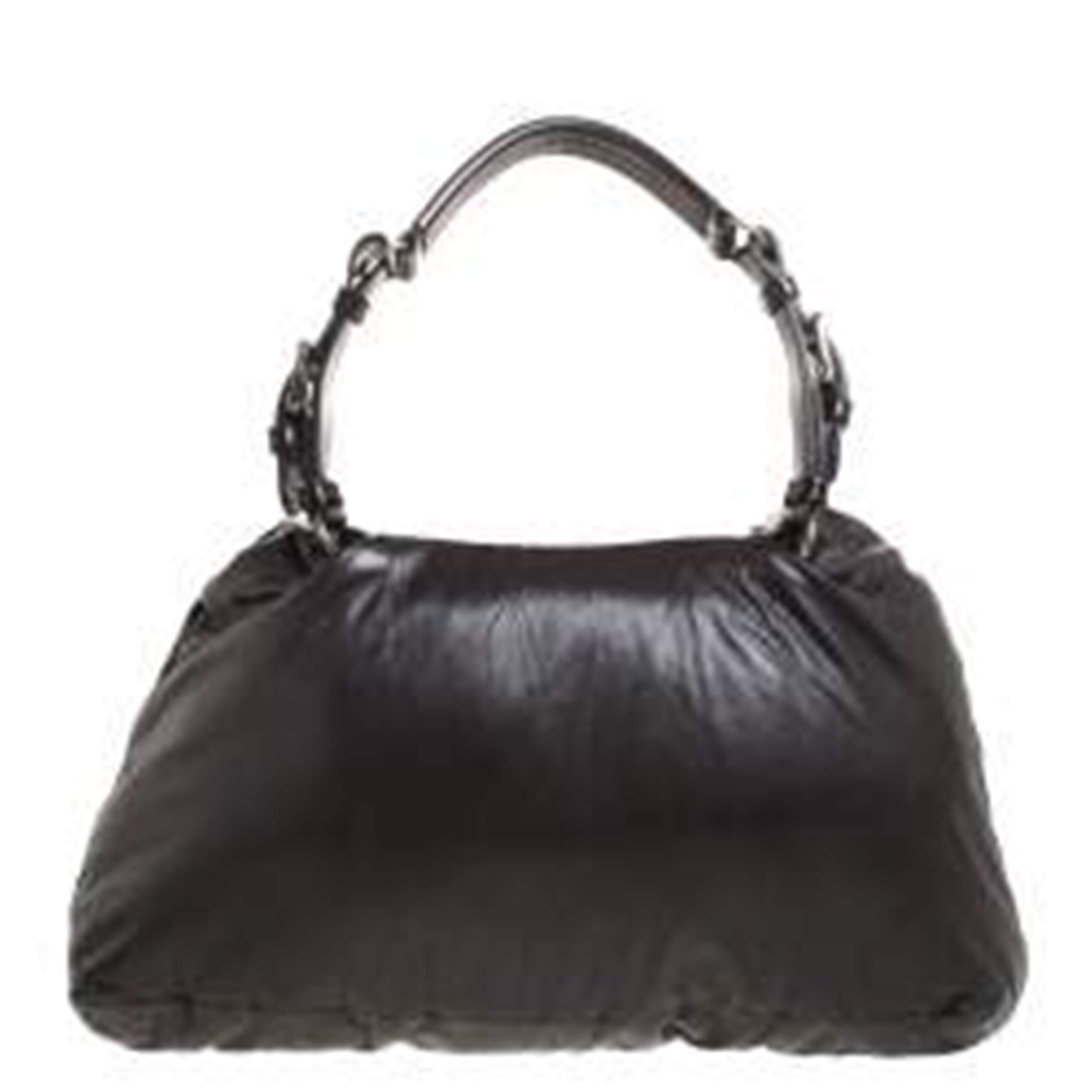 Step out swinging this amazing bag from Marni. It has been crafted from dark grey leather and styled with a frame flap. The satin-lined interior is spacious and the bag comes with a single handle. This creation can be teamed up with various outfits