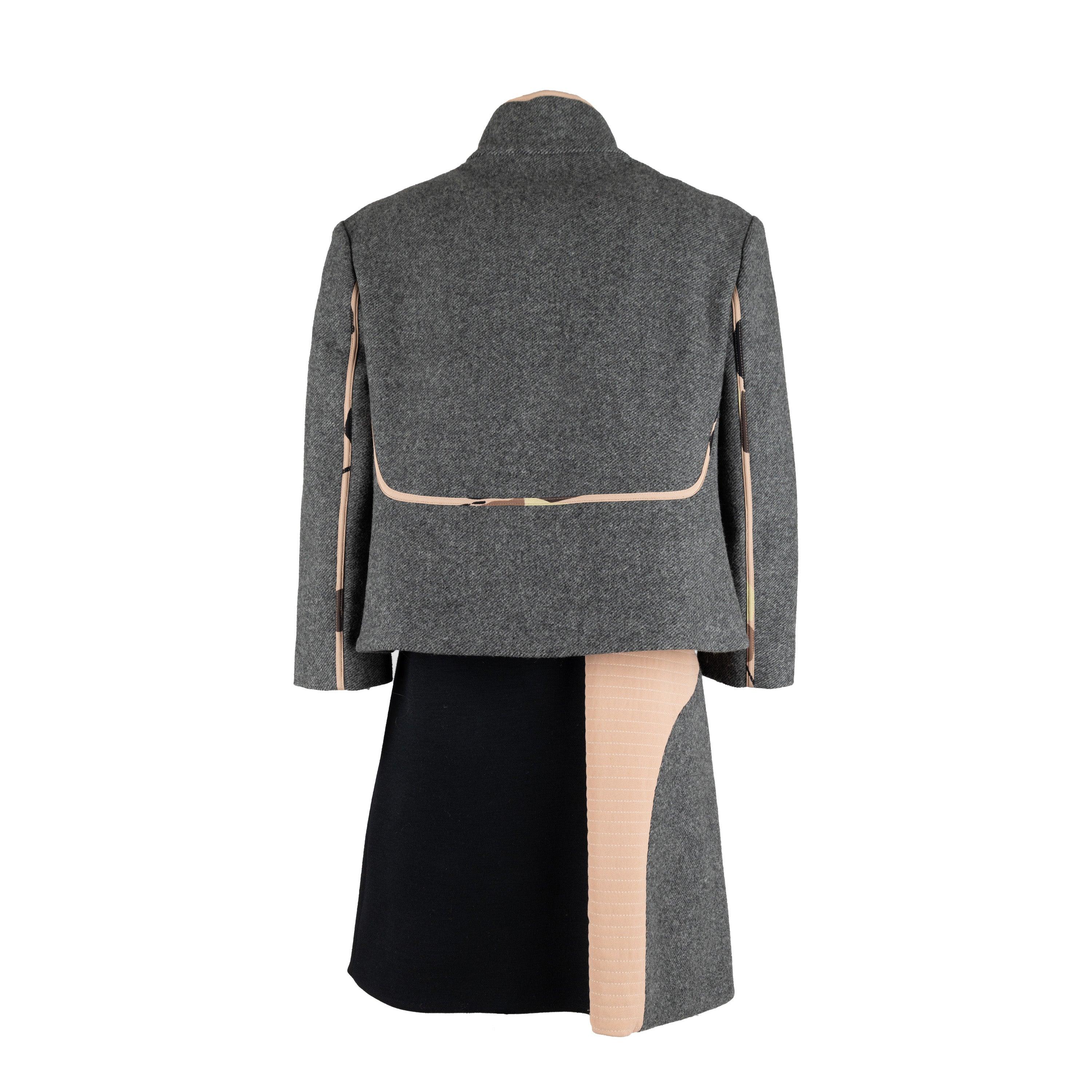 This Marni Dress and Jacket Set is crafted from a luxurious wool blend fabric. The grey fabric is complemented by striking beige and black colorblock pattern, as well as an elegant a-line silhouette. The accompanying jacket features contrasting silk