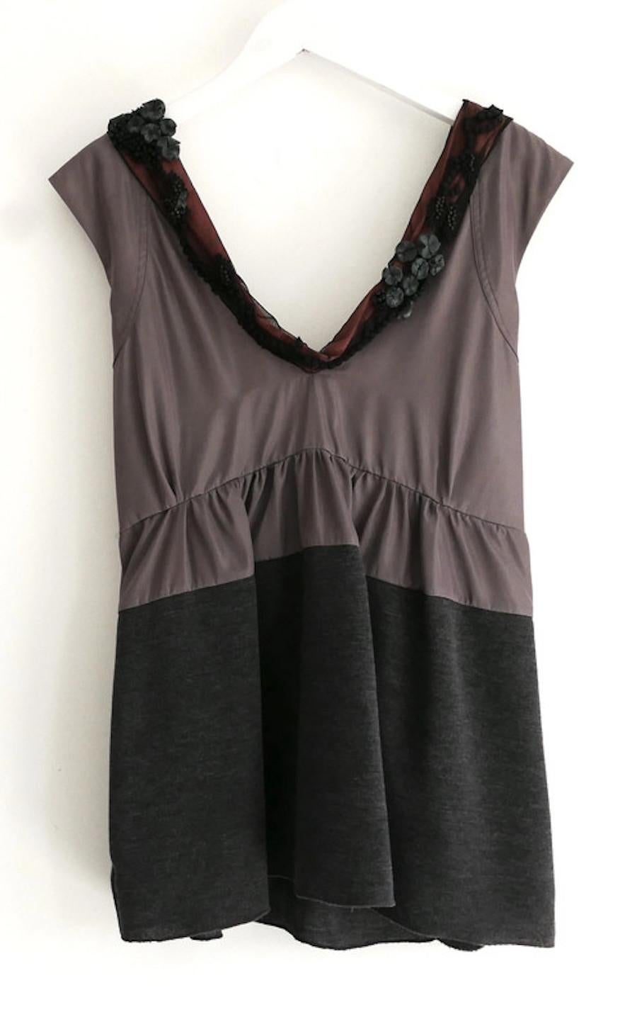 Stunning Marni top - worn once and has been newly dry cleaned. Made from crisp grey silk taffeta with a knitted hem and stunningly embellished satin and tule neckline. It has a loose fit with deep scooped neck and has long sash ties inside to adjust