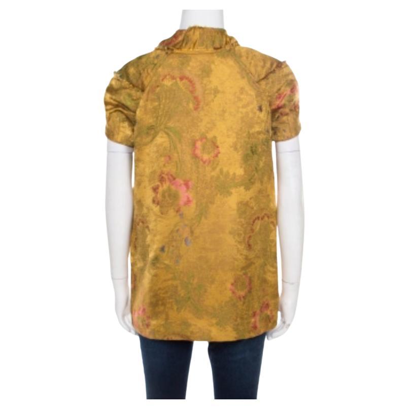 Nos encanta este top de Marni por su gran estilo y atractivo. Se presenta en dorado con jacquard floral, remates deshilachados y mangas casquillo. Puedes combinarlo con pantalones o faldas y tacones altos.