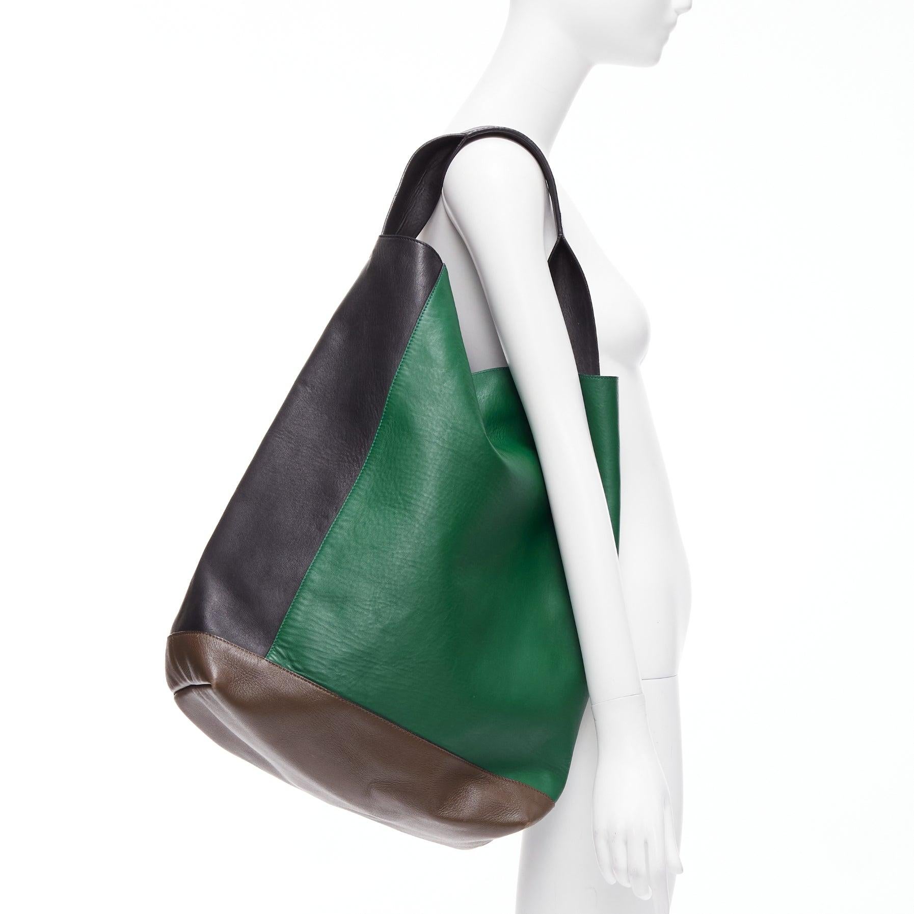 MARNI green black brown colorblock thick handle large shoulder tote bag
Reference: NKLL/A00245
Brand: Marni
Material: Leather
Color: Green, Black
Pattern: Solid
Closure: Snap Buttons
Lining: Black Fabric
Extra Details: Black and green colorblock at