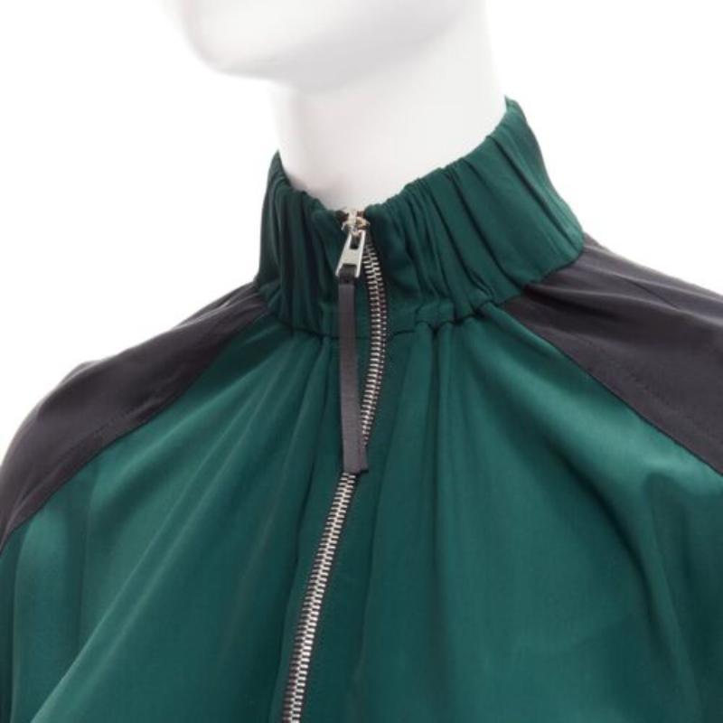 MARNI green black colorblock batwing track suit inspired dress IT36 XS
Reference: CELG/A00301
Brand: Marni
Material: Fabric
Color: Green, Black
Pattern: Solid
Closure: Zip
Extra Details: Front half zip with leather tab.

CONDITION:
Condition: Good,