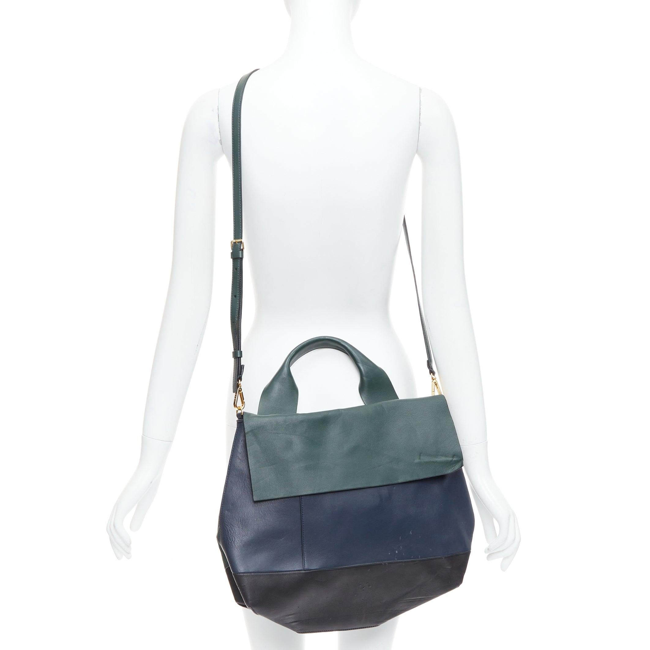 MARNI green navy black tricolor colorblock satchel flap bag
Reference: ECLO/A00064
Brand: Marni
Material: Leather
Color: Green, Navy
Pattern: Solid
Closure: Flap
Lining: Cream Fabric

CONDITION:
Condition: Poor, this item was pre-owned and is in