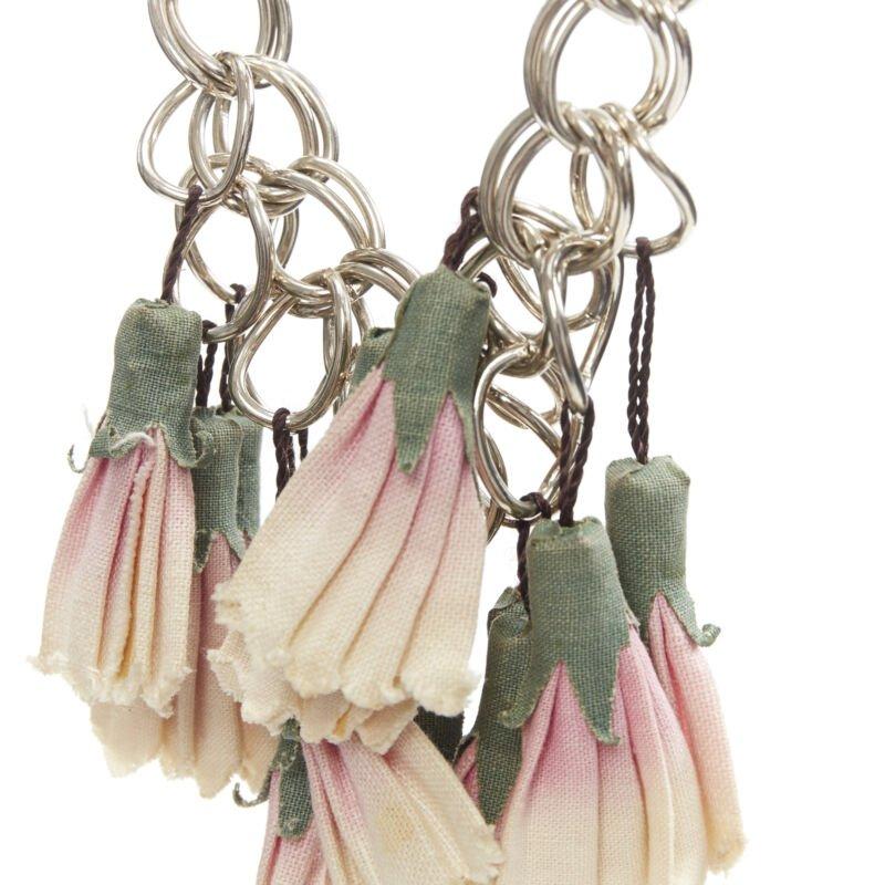 MARNI green pink canvas flower tassel silver ring chain leather trim necklace
Reference: UIHG/A00004
Brand: Marni
Material: Canvas, Metal, Leather
Color: Pink
Pattern: Floral
Closure: Button

CONDITION:
Condition: Fair, this item was pre-owned and