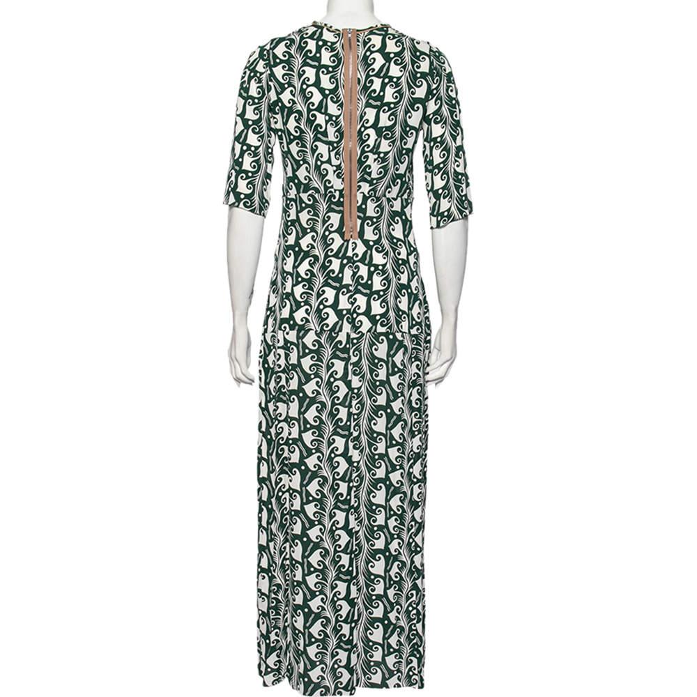 This maxi dress from Marni's Pre Fall 2010 collection is carefully tailored into a simple silhouette and added with a round neckline, mid sleeves, pleat accents, and lovely prints. A back zipper ensures a comfortable fit.

