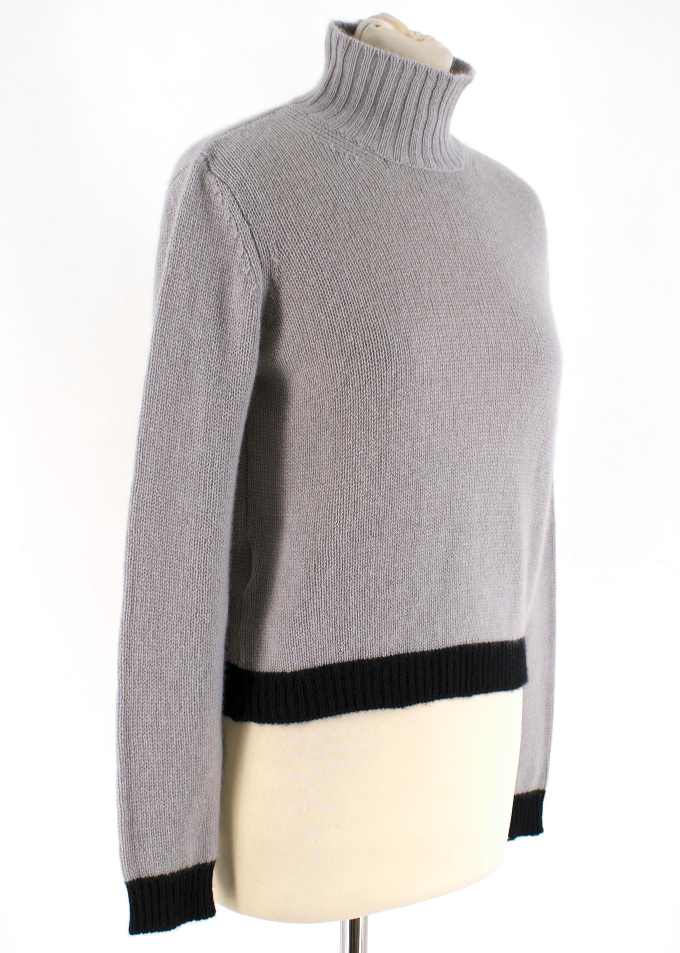 Marni Grey Cashmere Jumper RRP £595.00

- High neckline 
- Long Sleeves 
- Straight Hemline 
- Black Contrast Detail on Hemline and Cuffs

100% Cashmere 

Made in Italy 

Please note, these items are pre-owned and may show signs of being stored even