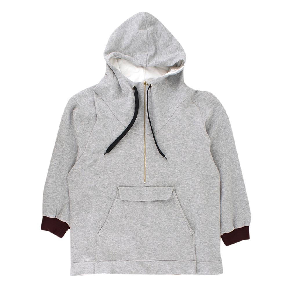 Marni Grey Jersey Half Zip Hoodie

- Grey & burgundy sweater
- Half zip
- Front pouch pocket
- Hooded
- Ribbed hems and cuffs
- Long sleeved

Please note, these items are pre-owned and may show signs of being stored even when unworn and unused. This