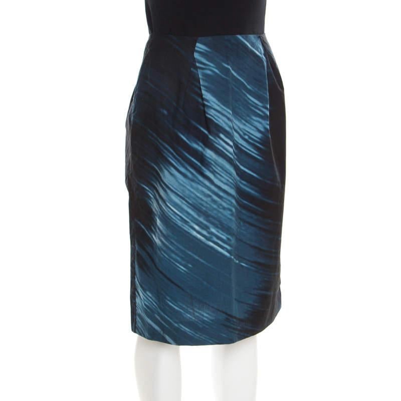 This skirt from Marni is well-tailored and comfortable. It is covered in prints and detailed with a back zipper. You can wear it with a black blouse, glossy pumps or sandals, a Cartier Love bracelet and a top handle leather bag.

