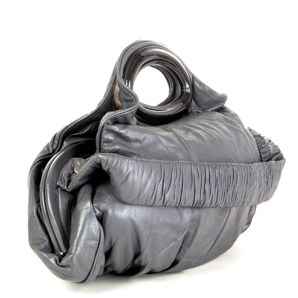 authentic Marni shoulder bag in iron grey smooth nappa leather with black acetate handle and pleated shoulder strap. Lined in grey nylon and divided in three compartments with one zipper against the back and one open pocket against the front. Has