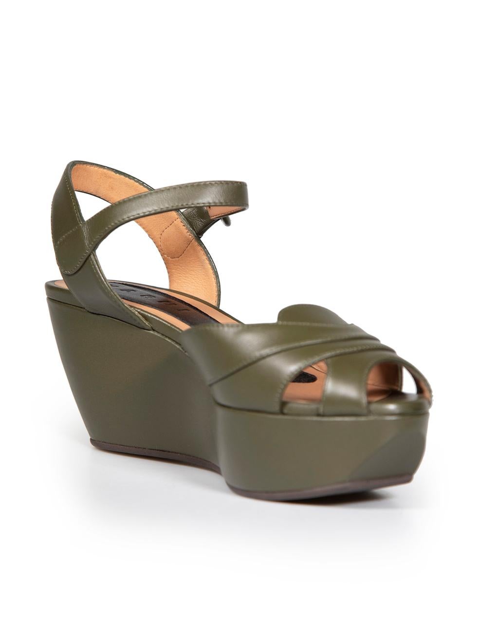CONDITION is Very good. Minimal wear to sandals is evident. Some very light scratches to the peep toe leather and the leather buckle on this used Marni designer resale item. These shoes come with original dust bag.
 
 
 
 Details
 
 
 Khaki
 
