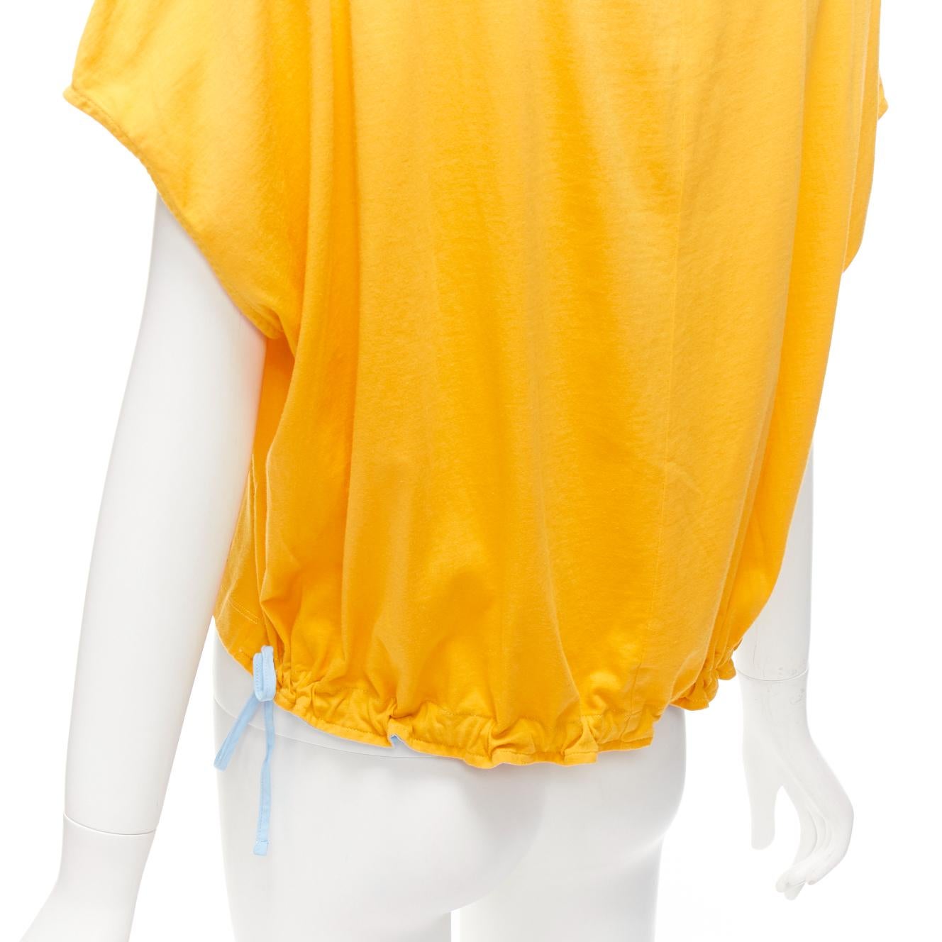 MARNI mango yellow cotton blue trim ruched sides cap sleeve t-shirt top IT38 XS
Reference: CELG/A00414
Brand: Marni
Material: Cotton
Color: Yellow, Blue
Pattern: Solid
Closure: Self Tie
Extra Details: Self tie sides hem.
Made in: