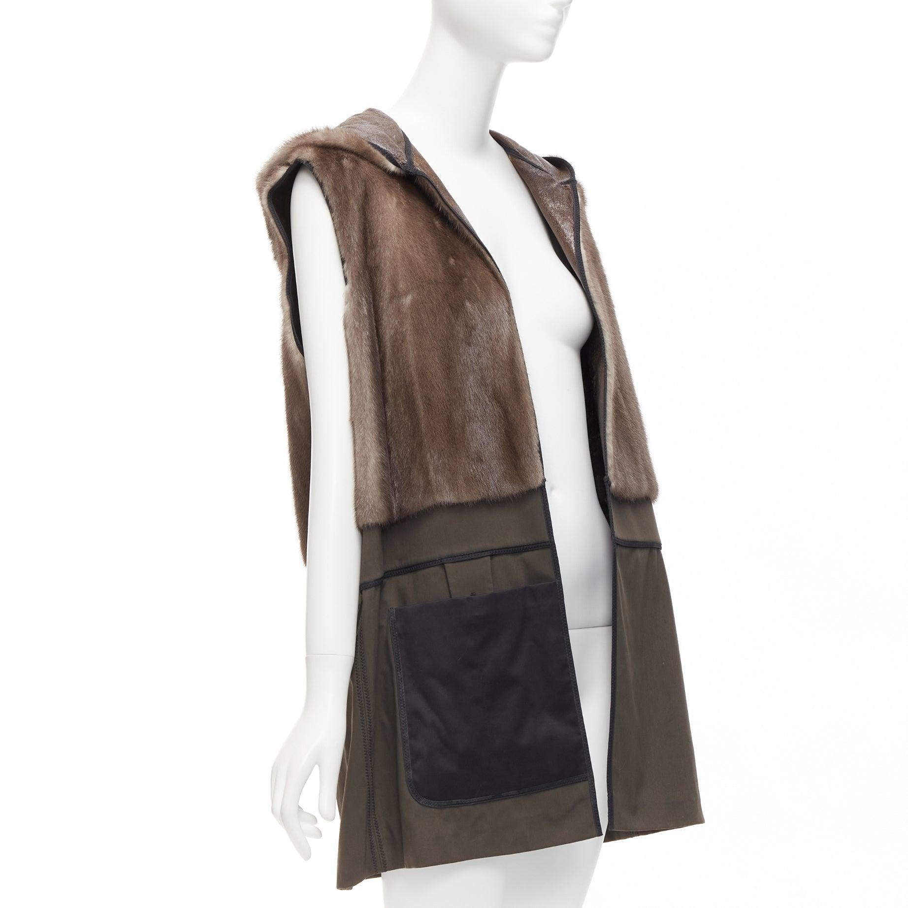 MARNI Mink Gilet Reversible brown colorblocked textured fur hooded vest IT40 S
Reference: DYTG/A00001
Brand: Marni
Model: Mink Gilet
Material: Fur, Leather, Fabric
Color: Brown, Khaki
Pattern: Solid
Lining: Brown Fur
Extra Details: Reversible.
Made