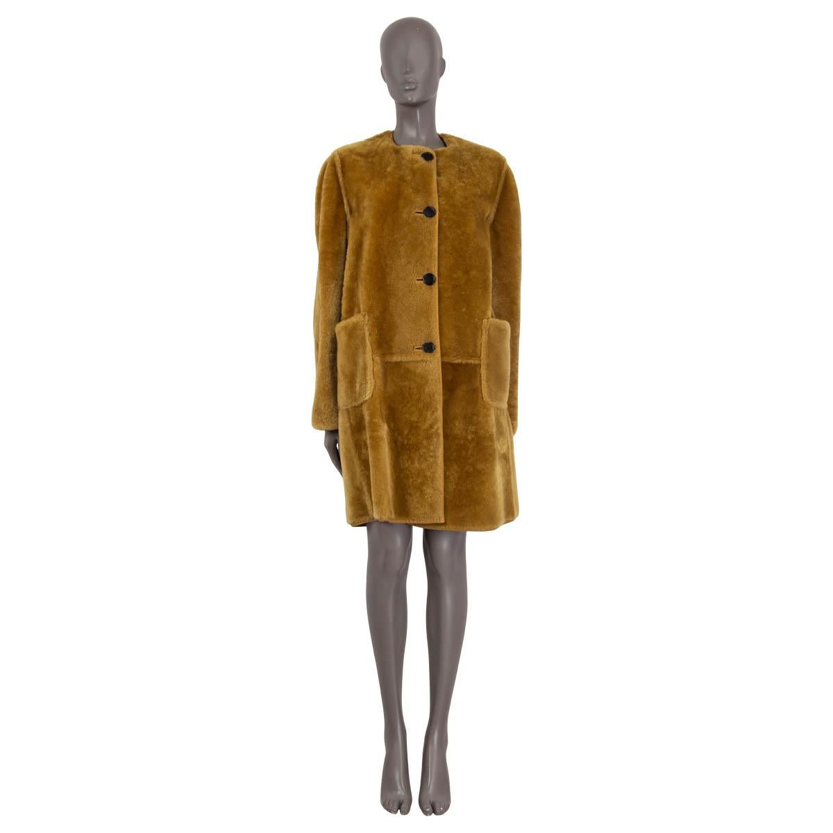 100% authentic Marni reversible long sleeve coat in domesticated lamb shearling (100%). Comes with two front pockets and a crew neck. Opens with four buttons on the front. Unlined. Has been worn and is in excellent condition. 

Measurements
Tag