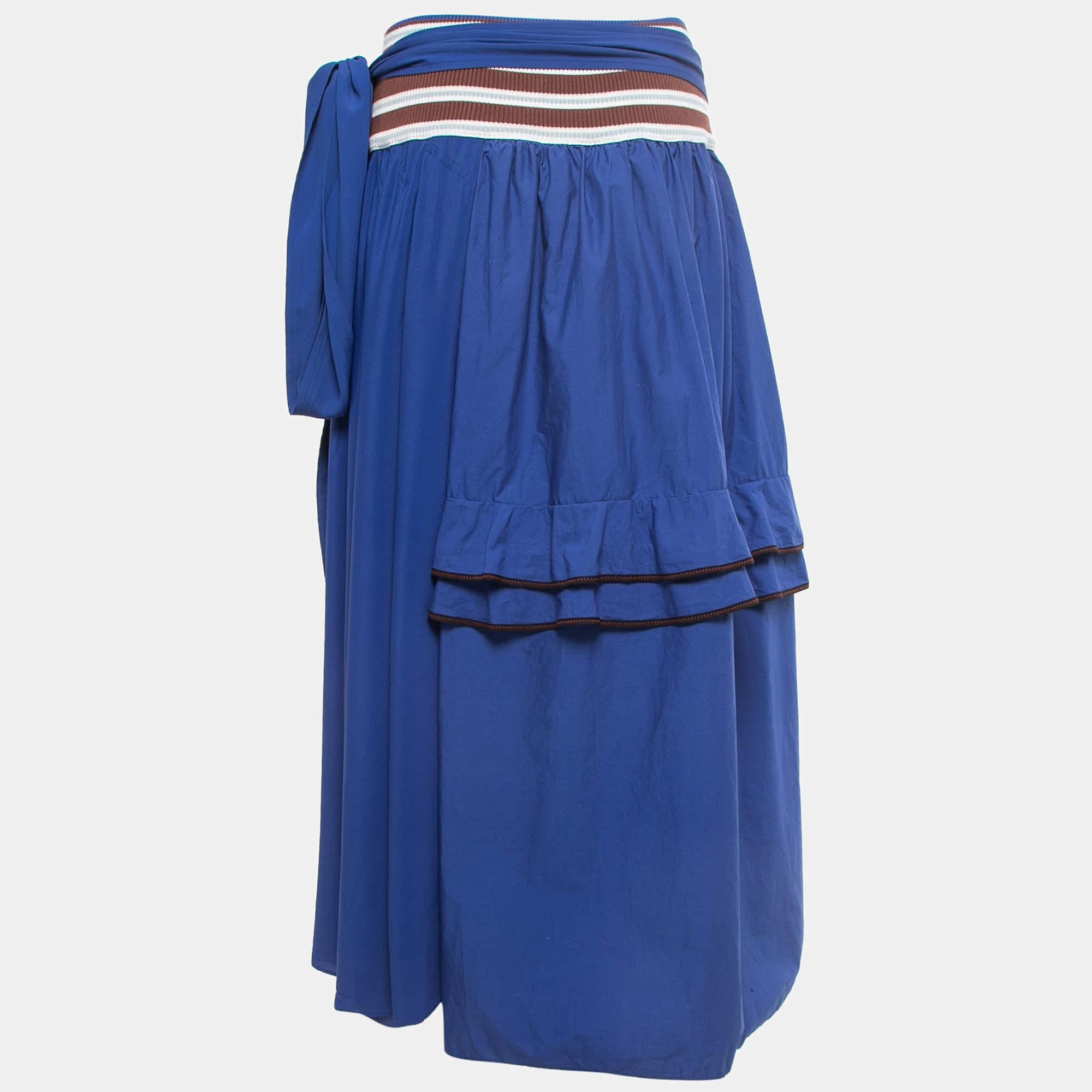 This lovely skirt is beautifully stitched from cotton and silk. It has a striped waistband with tie detail and a half ruffle trim on the skirt. Wear it with a fitted top flats and a wicker bag for a casual day look.