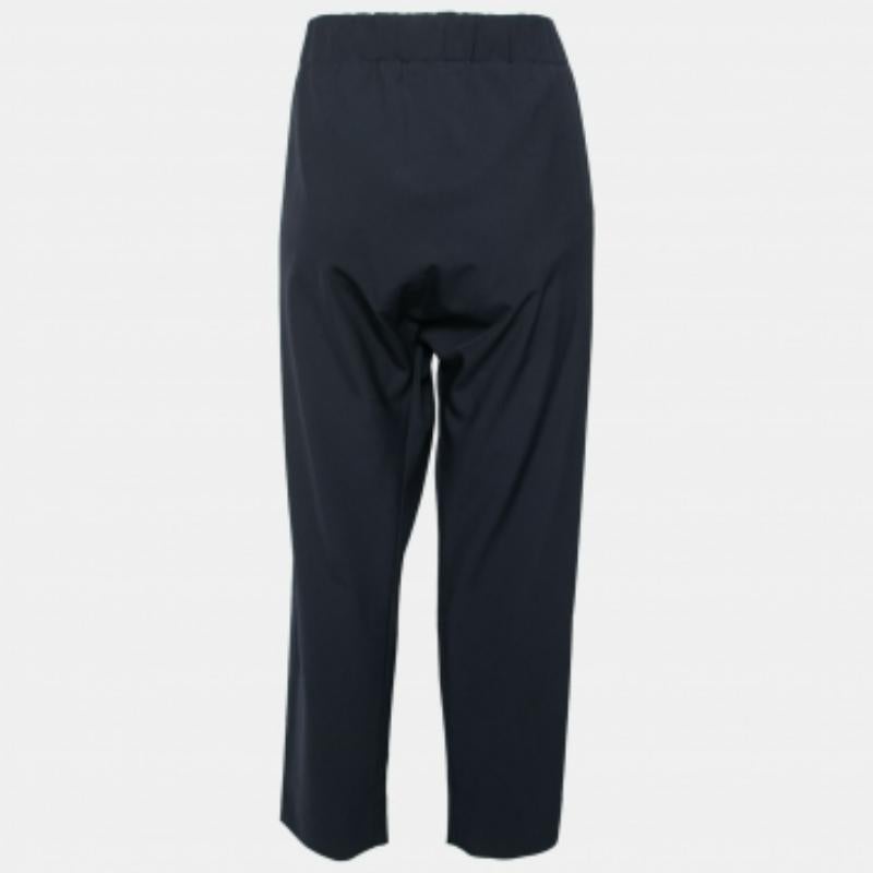 The black shade of this pair of Marni tapered pants makes it a versatile styling option. Created from a mix of quality fabrics, it flaunts a front zipper closure, an elasticized waist, and a perfect fit. Wear it with a complementing top or shirt for