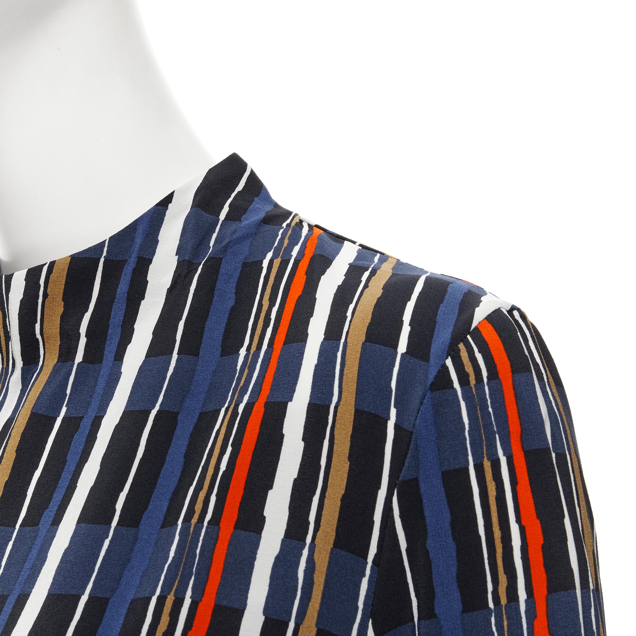 MARNI navy blue stripe print silk wide cuff collarless blouse top IT40 S 
Reference: CELG/A00140 
Brand: Marni 
Material: Silk 
Color: Blue 
Pattern: Striped 
Closure: Zip 
Extra Detail: Button cuff. 
Made in: Portugal 

CONDITION: 
Condition: