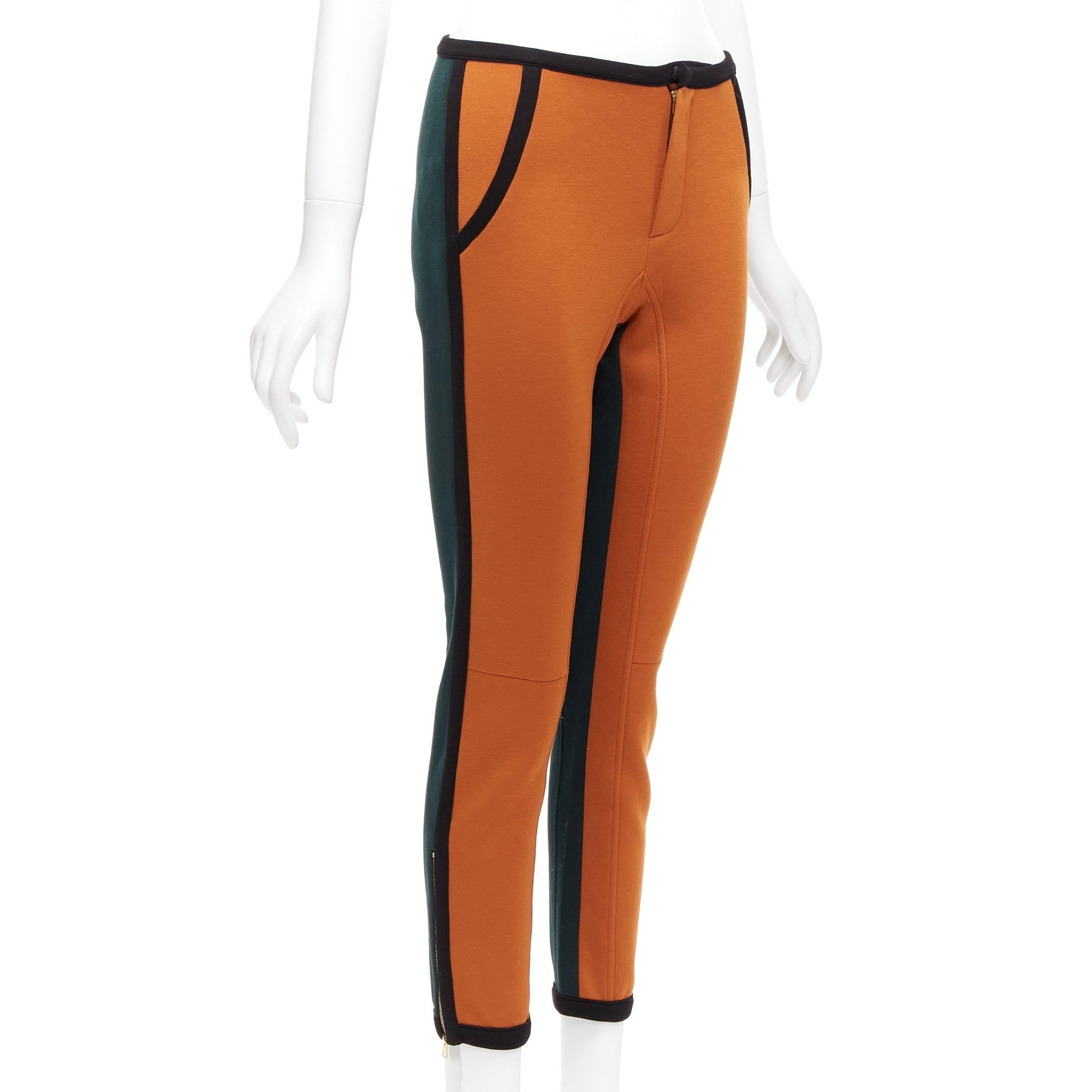 MARNI orange green colorblock black piping jogger pants IT38 XS
Reference: NKLL/A00071
Brand: Marni
Material: Viscose
Color: Orange, Green
Pattern: Solid
Closure: Zip Fly
Extra Details: Side zips at hems.
Made in: Italy

CONDITION:
Condition: Very