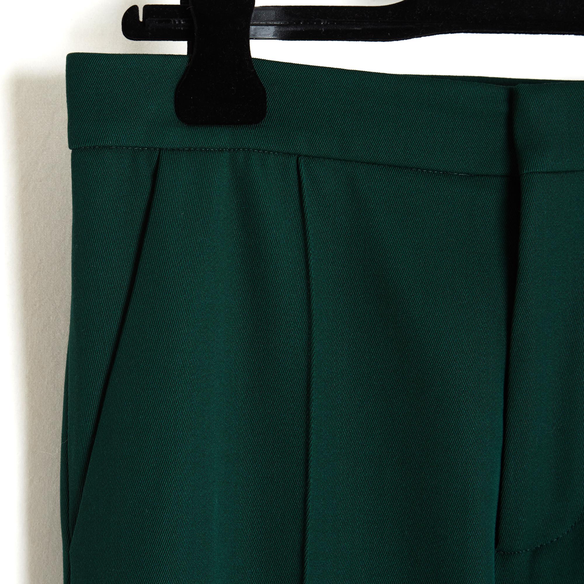 Marni trousers in mid-weight dark green wool twill (and 3% elastane), flared or slightly trumpet-shaped, 2 slanted slit pockets on the sides and 2 slit pockets (always closed) on the back, fastening with a hook, a button and a zip at the mid-rise