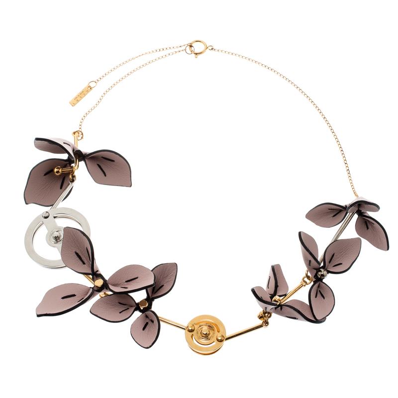 This season replace your simple jewelry with this grand statement necklace from Marni. This two-tone metal necklace is a symbolic piece of elegant finish and stunning luxe design. It is designed with metal charms and leather flowers and is complete