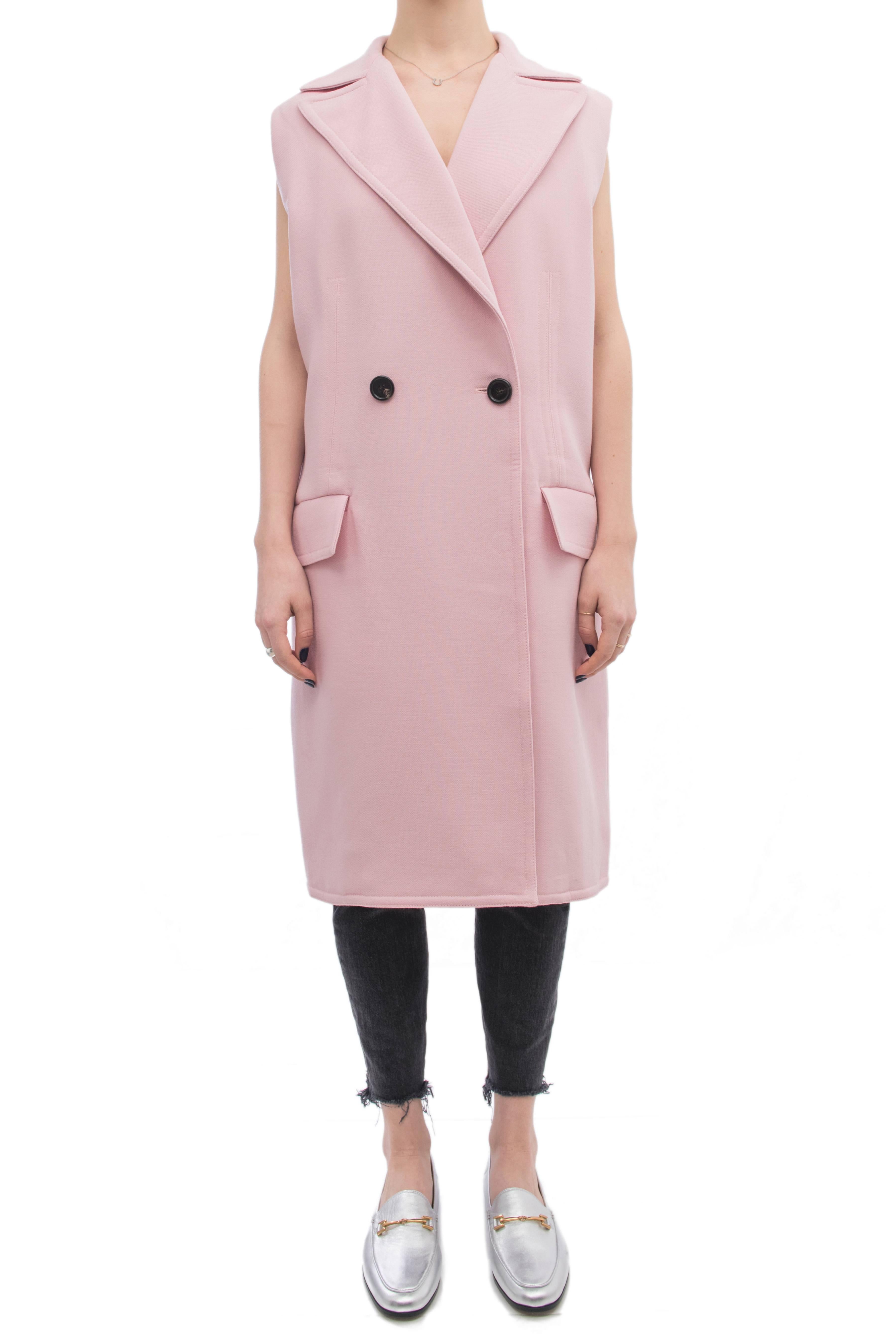 Marni pink wool long coat vest.  Side hip pockets, two font buttons, notched collar.  Marked size IT 38 (USA 6). This garment is designed to be worn very oversized so can fit a USA 8/10 as well.  Garment measures 46” at bust and hip.  Back neck seam