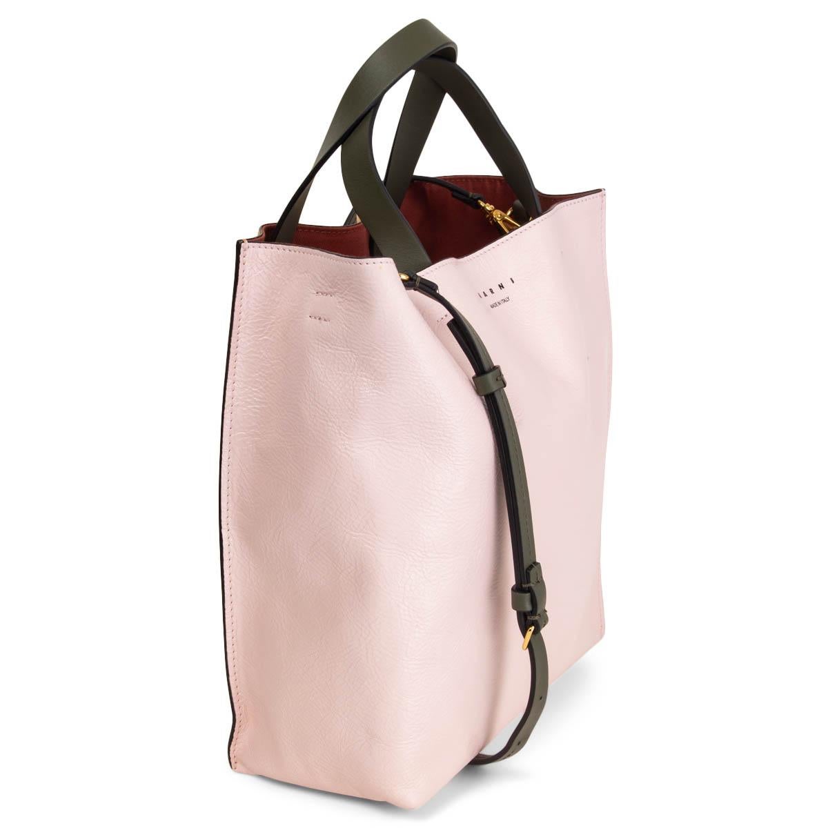 100% authentic Marni Museo Small tote bag in tricolor pale rose, pale yellow and olive green calfskin. Contrasting internally applied handles and edges. Lined in burgundy canvas with one leather zipper pocket against the back. Adjustable and