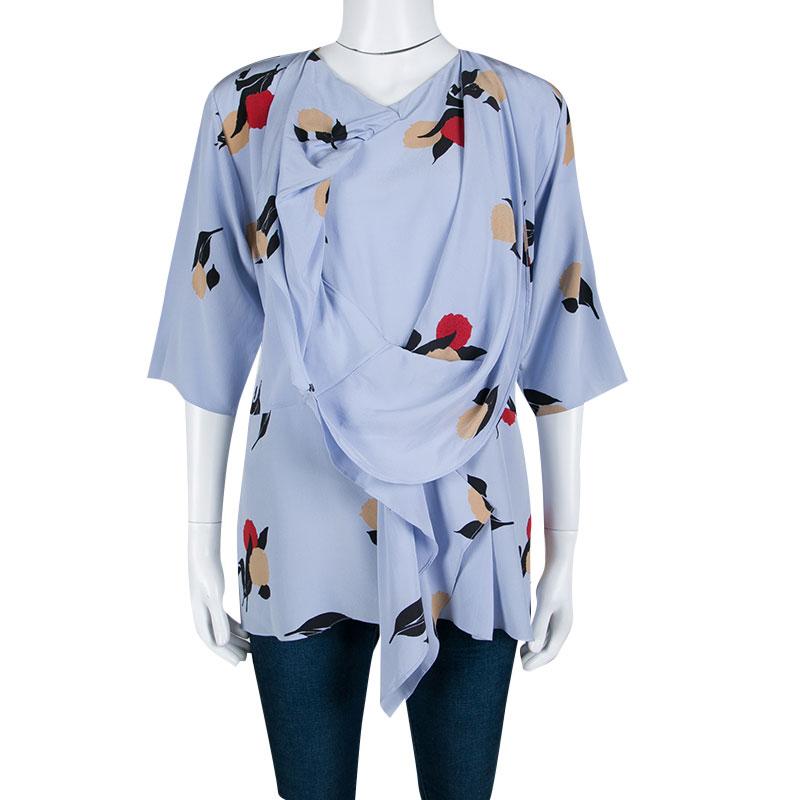 Marni's blouse is fashionable as well as comfortable; it is truly meant for the women who love an understated style. It is crafted in a wrap style that looks flattering on all body types. The powder blue piece has a lovely floral print all over and