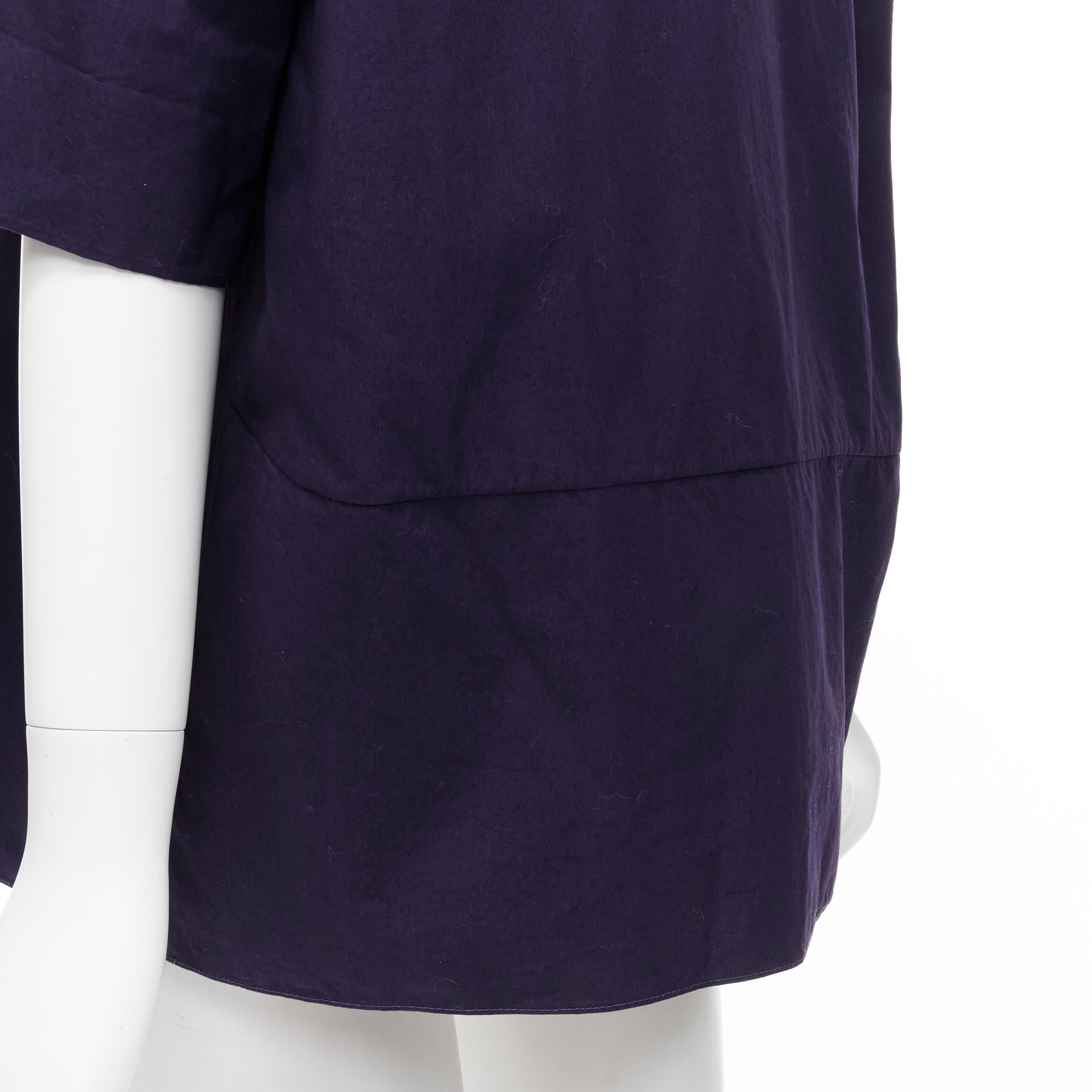 MARNI purple cotton curved seam V-neck oversized boxy polo shirt top IT44 M 
Reference: CELG/A00133 
Brand: Marni 
Material: Cotton 
Color: Purple 
Pattern: Solid 
Made in: Italy 

CONDITION: 
Condition: Excellent, this item was pre-owned and is in