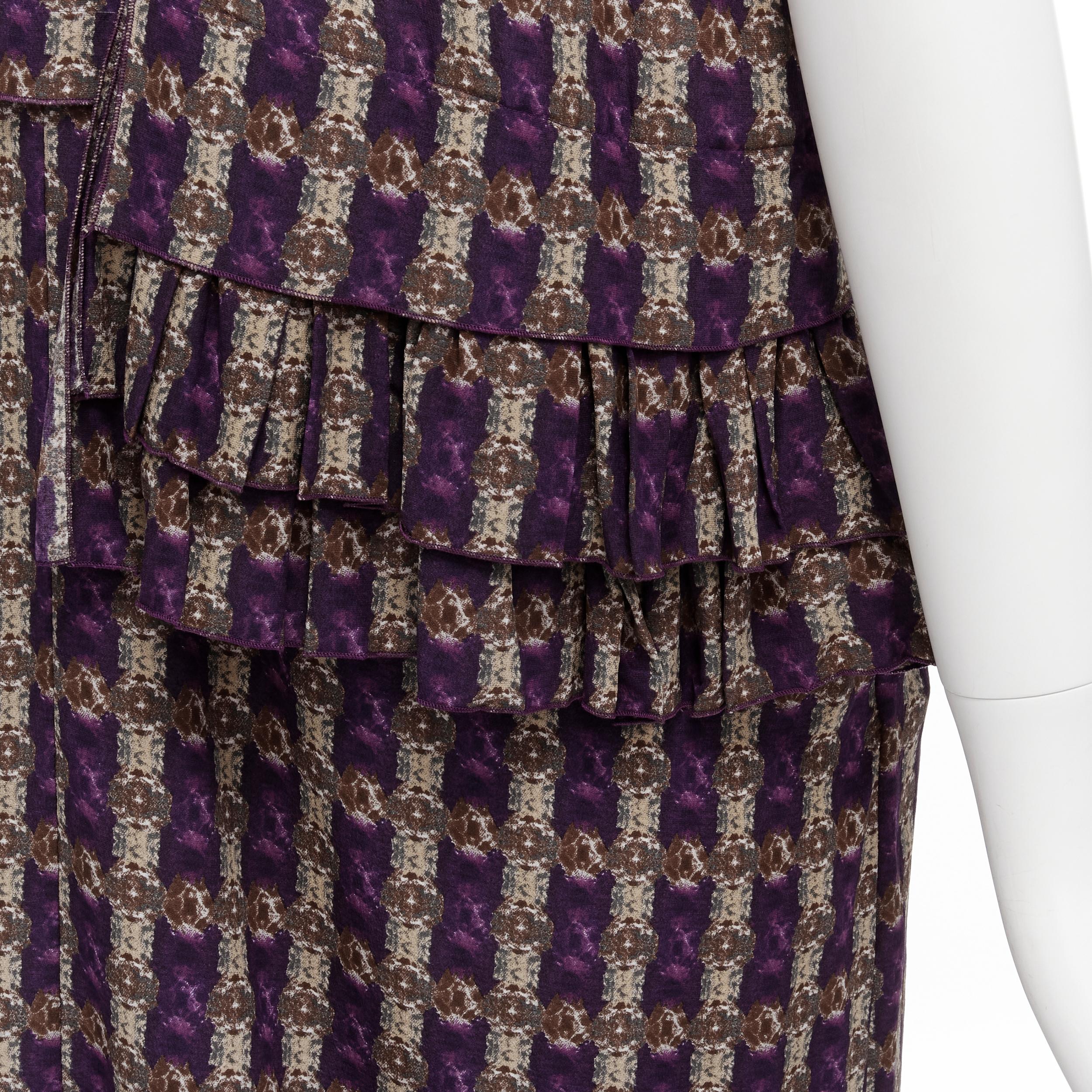 MARNI purple jewel print tier ruffle waist sheath dress IT38 XS 
Reference: CELG/A00110 
Brand: Marni 
Material: Silk 
Color: Purple 
Pattern: Geometric 
Closure: Zip 
Extra Detail: Dual side pockets under ruffles. 
Made in: Italy 

CONDITION: