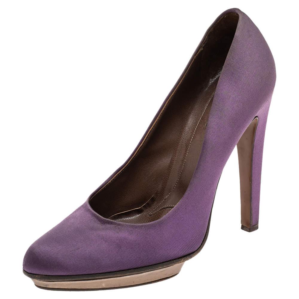There are some shoes that stand the test of time and fashion cycles these timeless Marni pumps are the one. Crafted from satin in a purple shade they are designed with sleek cuts round toes and tall heels.