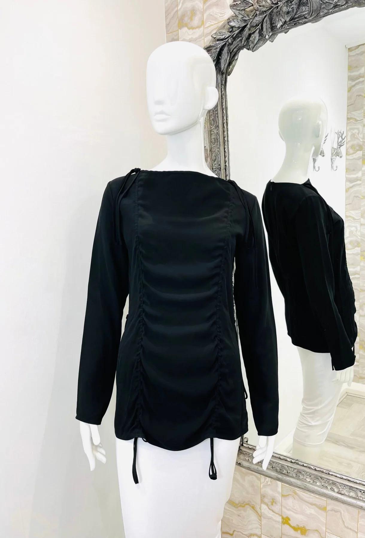 Marni Ruched Top

Black top with long sleeves, ruching and self tie detailing.

Additional information:
Size – 38IT
Composition – 58% Viscose, 42% Acetate
Condition – Very Good