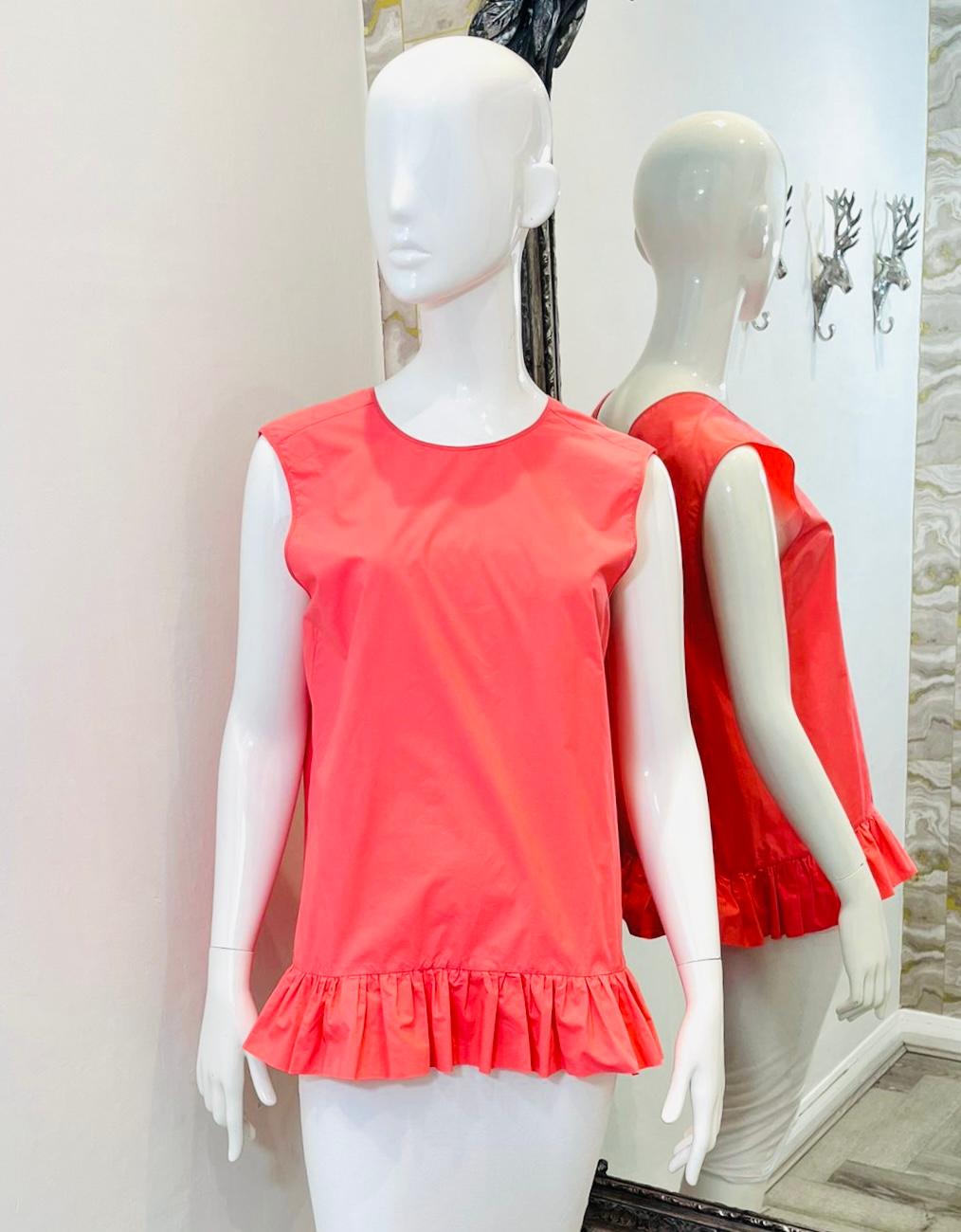 Marni Ruffle Detail Cotton Top

Coral sleeveless blouse designed with ruffle trimmed hem.

Featuring relaxed fit, round neckline to the front and V-Neck to rear.

Size – 44IT

Condition – Very Good

Composition – 100% Cotton