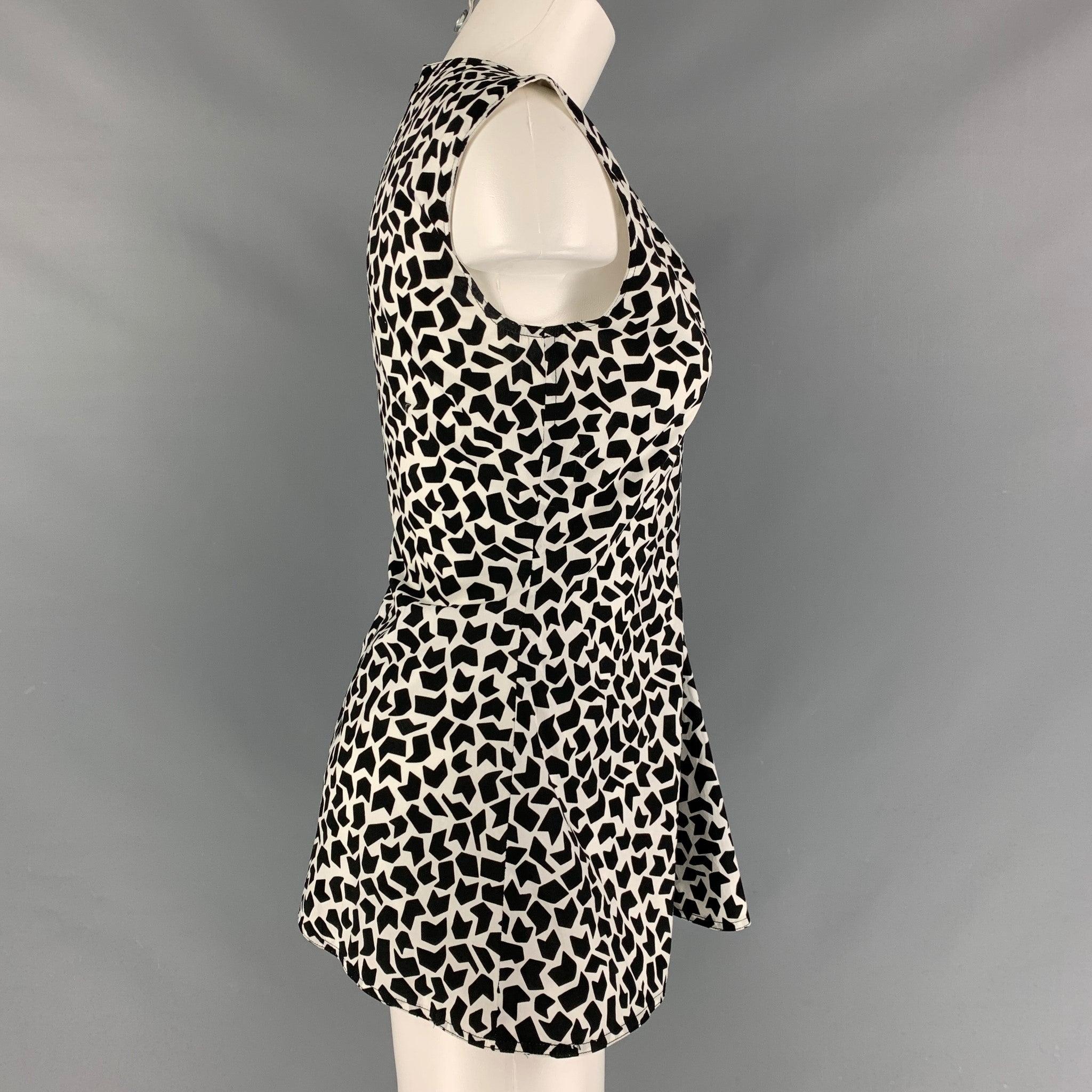 MARNI sleeveless tunic comes in a black and white abstract print cotton poplin featuring an open V-neck shape, and full zip up closure at center back. Made in Italy.Excellent Pre-Owned Condition. 
 

 Marked:  36 
 

 Measurements: 
  
 Shoulder: 16